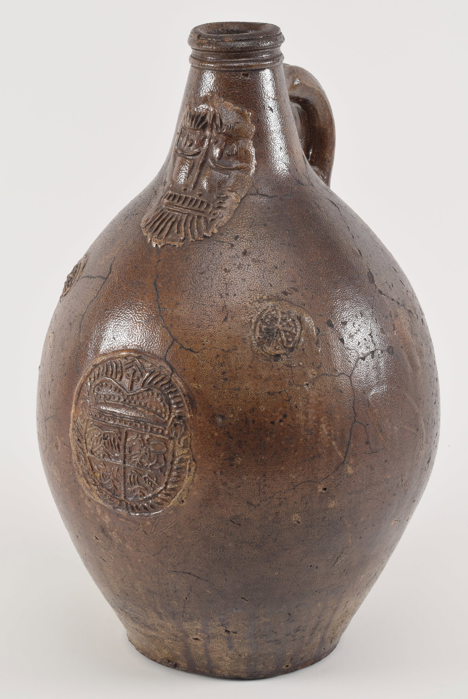 Large bellarmine early stoneware jug with bearded face and medallion decoration. 17in high. (1 of 7)