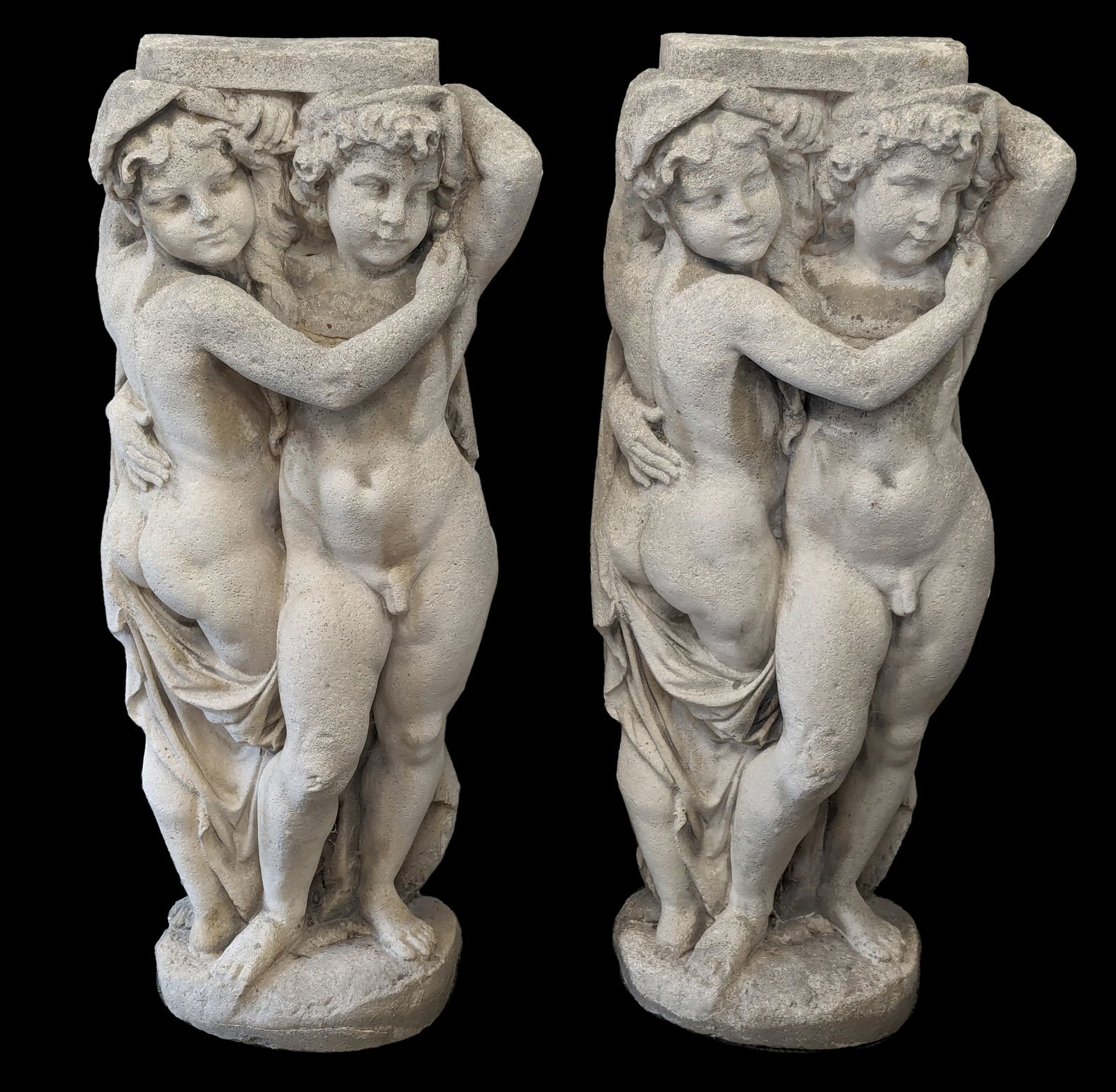 Pair of large cast stone figural cherub supports. Weathered condition. 44in high. (1 of 8)