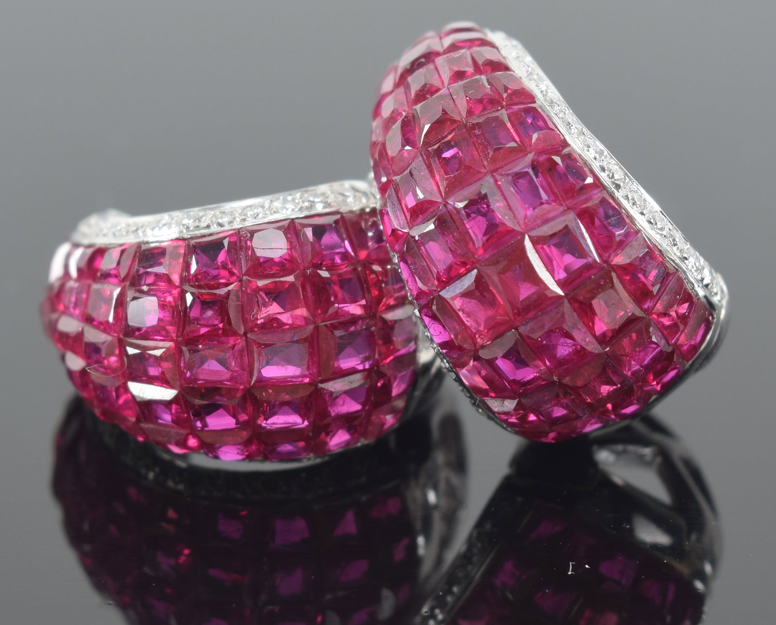 18K gold diamond and ruby mounted clip earrings. Each with 51 good color cut rubies. 0.68in long. (1 of 6)