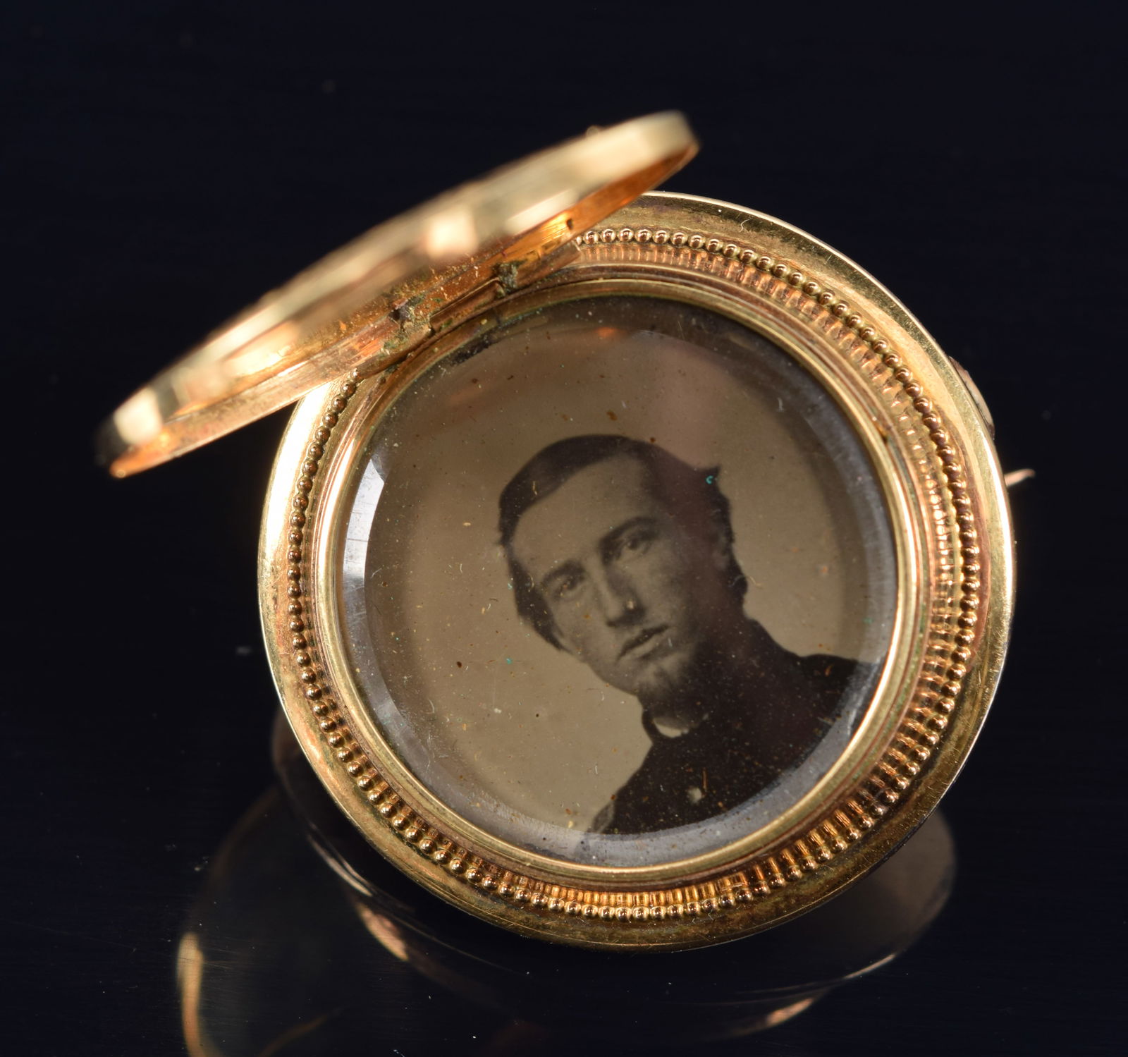 Antique gilt silver Civil War era round locket pin with a tintype of a soldier. Ornate relief floral (1 of 3)