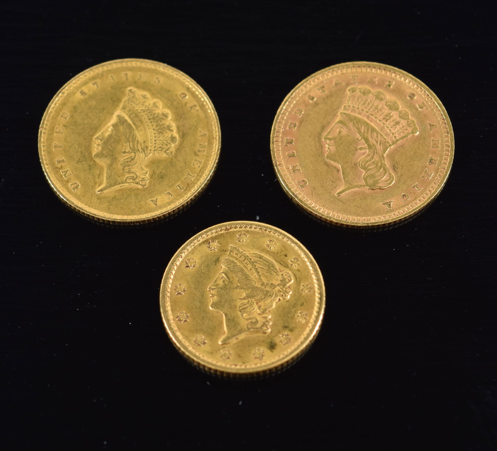 3 $1 American gold coins. 1) 1853. 2) 1858. 3) 1851. 5 grams total. (1 of 2)