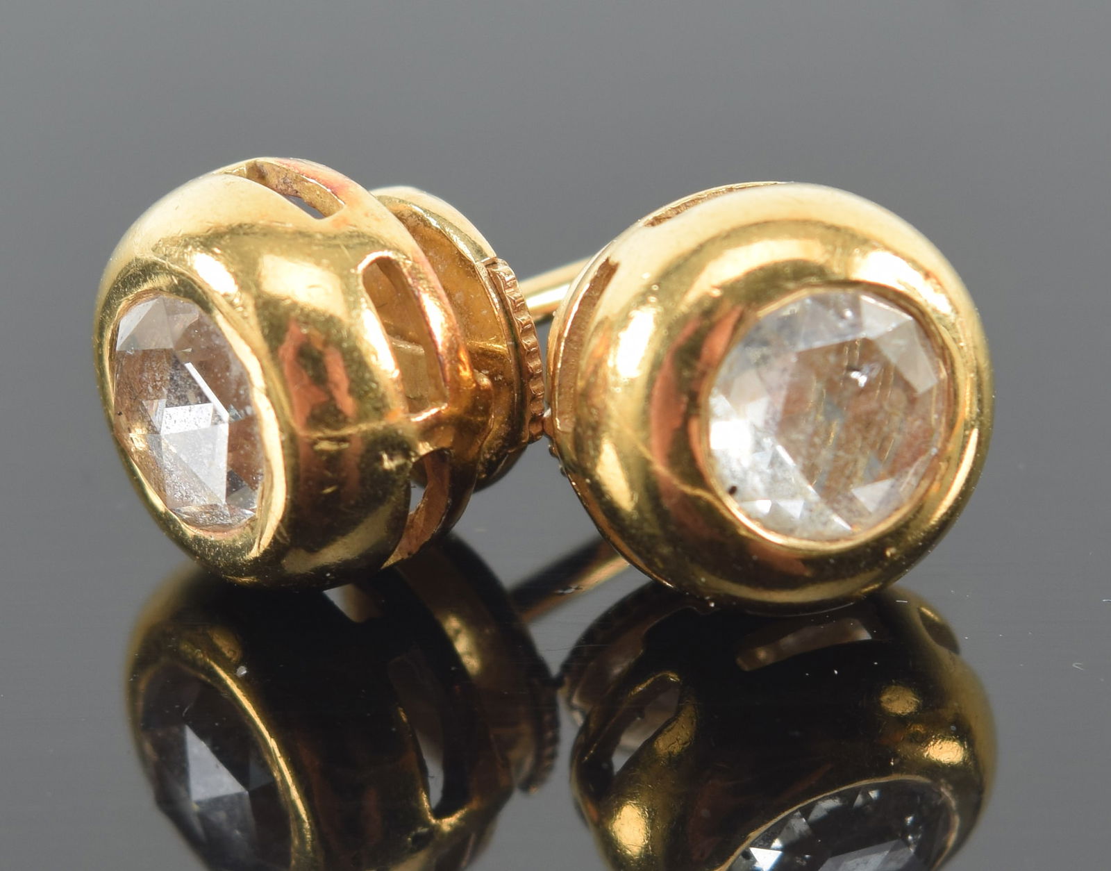 18K yellow gold diamond solitaire stud earrings. Each earring with a single rose cut diamond, (1 of 6)