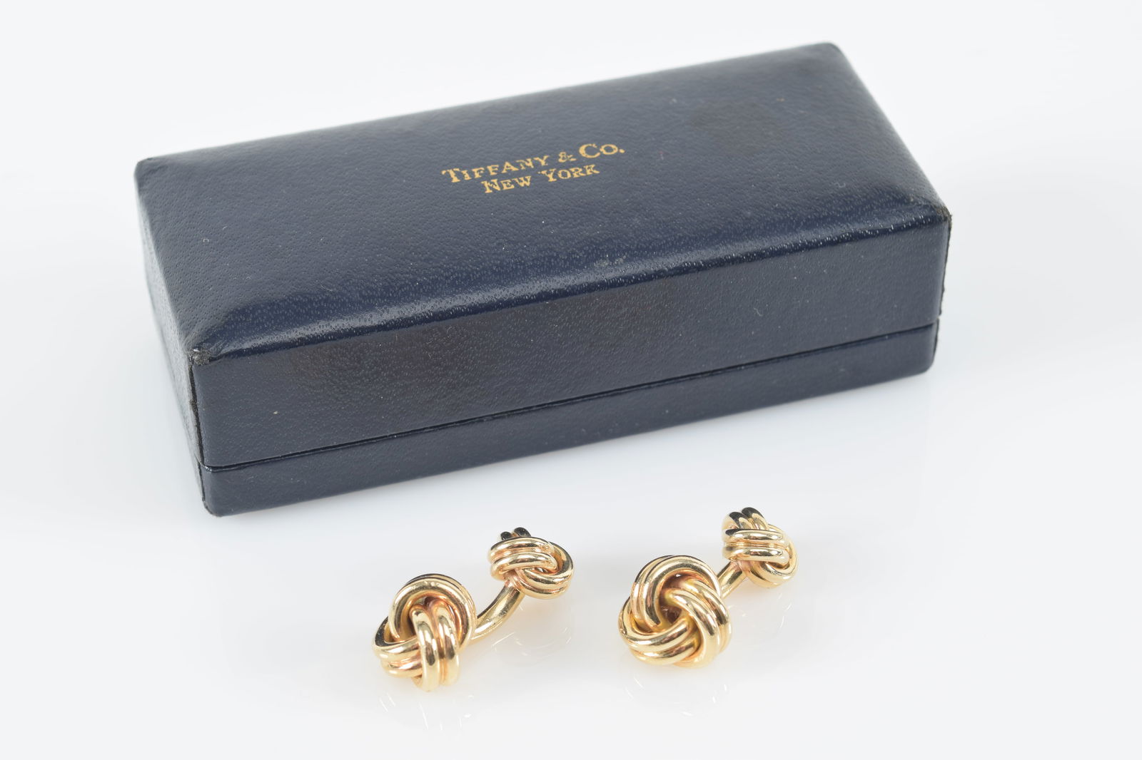 Tiffany & Co. 14K gold knot cufflinks. Marked "Tiffany & Co." and "14K" on stem. Includes original (1 of 6)
