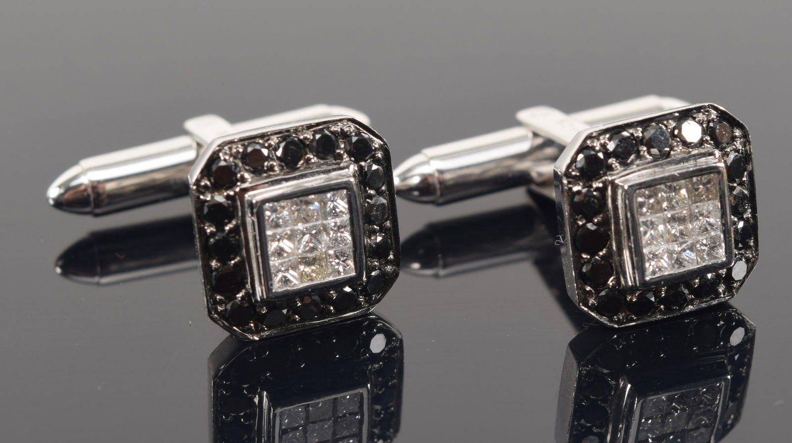 18K white gold diamond cufflinks. Diamond pave center surrounded by dark blue or black stones. (1 of 6)
