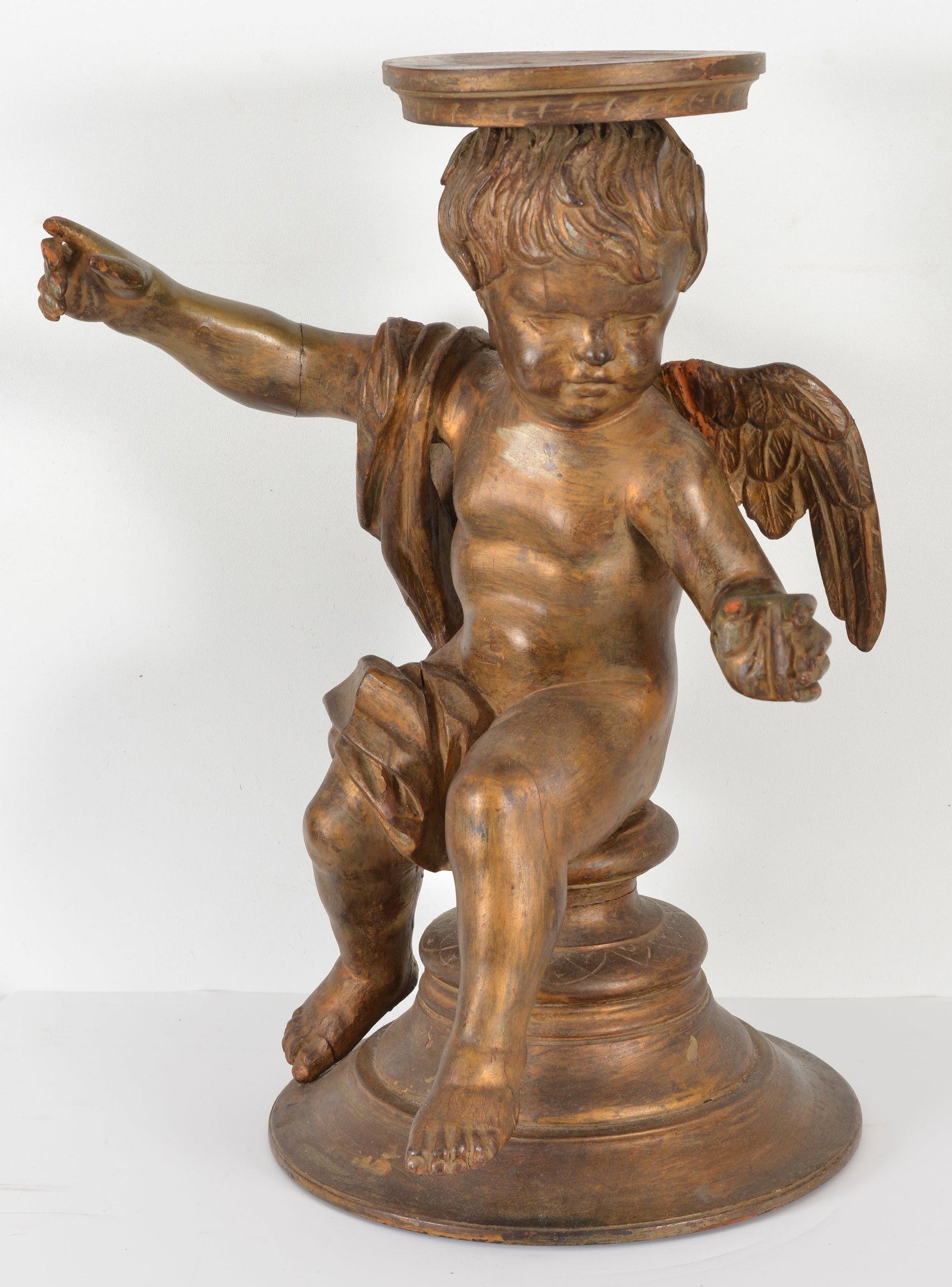 Carved wood and gilt painted cupid pedestal, 19th Century. Repairs to wings. Height 27 in.: Carved wood and gilt painted cupid pedestal, 19th Century. Repairs to wings. Height 27 in.