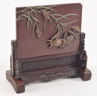 Table screen. China. 19th century. Tuan stone carved with crabs and plants, opposite side with a Li: Table screen. China. 19th century. Tuan stone carved with crabs and plants, opposite side with a Li shu inscription. Finely carved rosewood stand. 11.25 x 11.25in. Chips.
