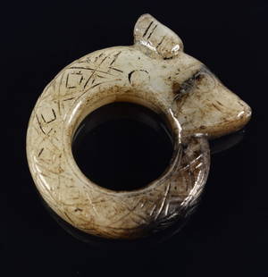 Jade ring. China. Sung period, 11 century. Grey stone with black markings. Kui dragon with overall: Jade ring. China. Sung period, 11 century. Grey stone with black markings. Kui dragon with overall lozenge engravings. 1.5in.