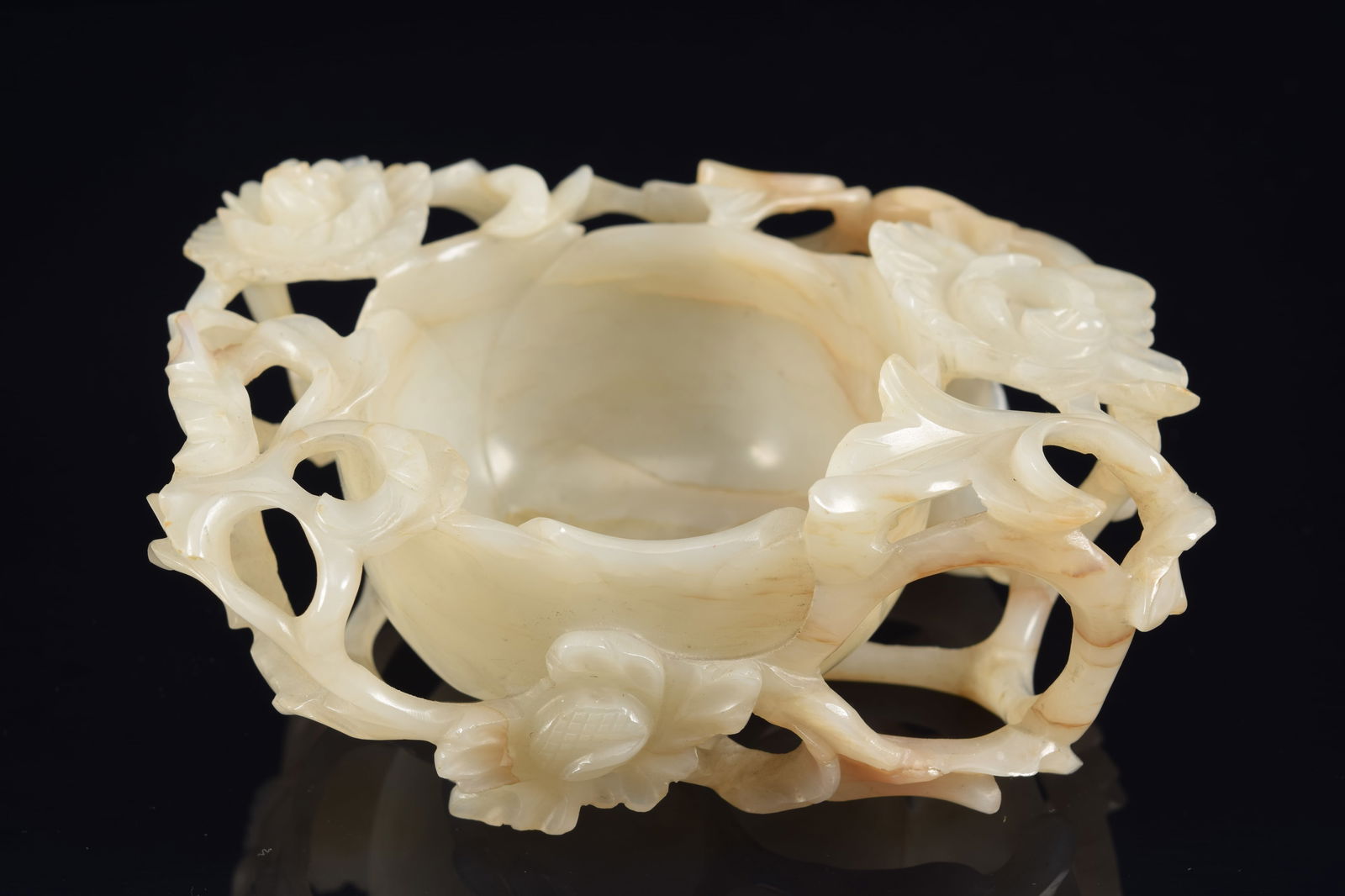 Jade cup. China. 18th century or earlier. Carved as an open blossom with foliage. 5in length. (1 of 6)