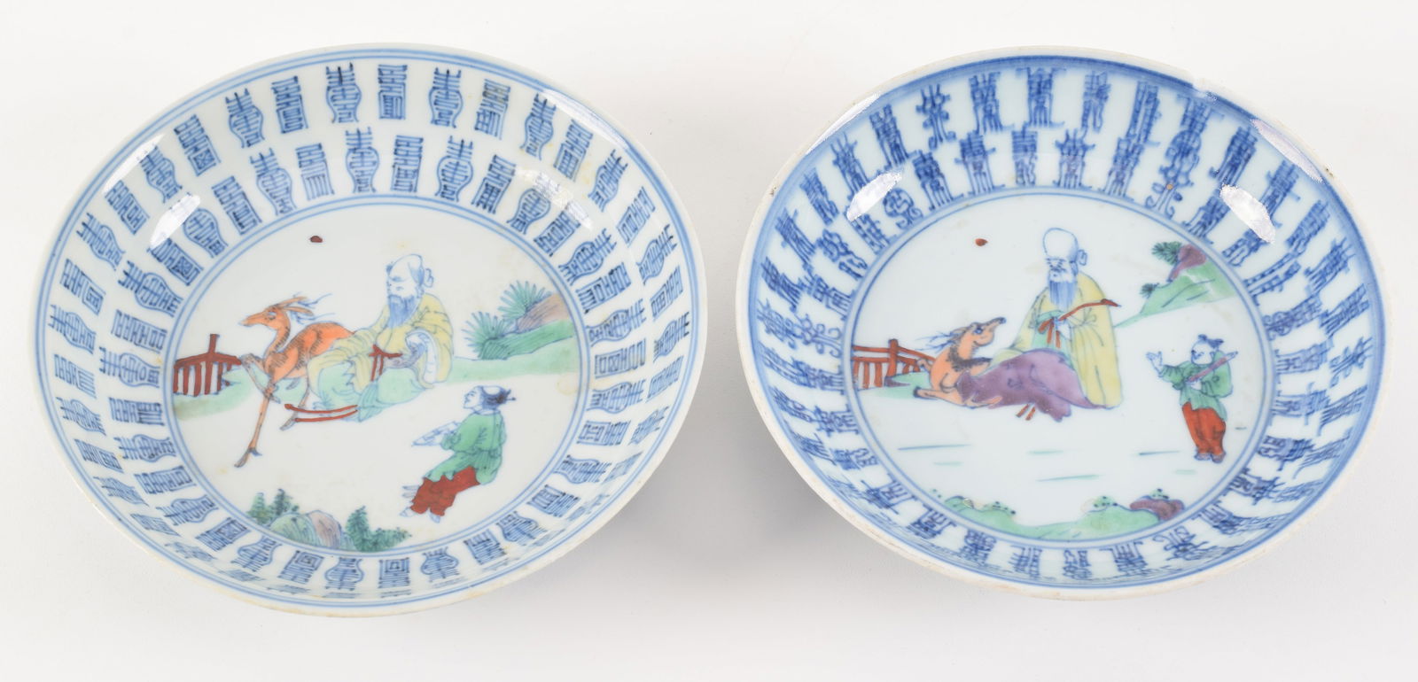 Pair of porcelain saucer dishes. China. 18th century. Tou tsai decoration of Shao Lao and a deer (1 of 7)