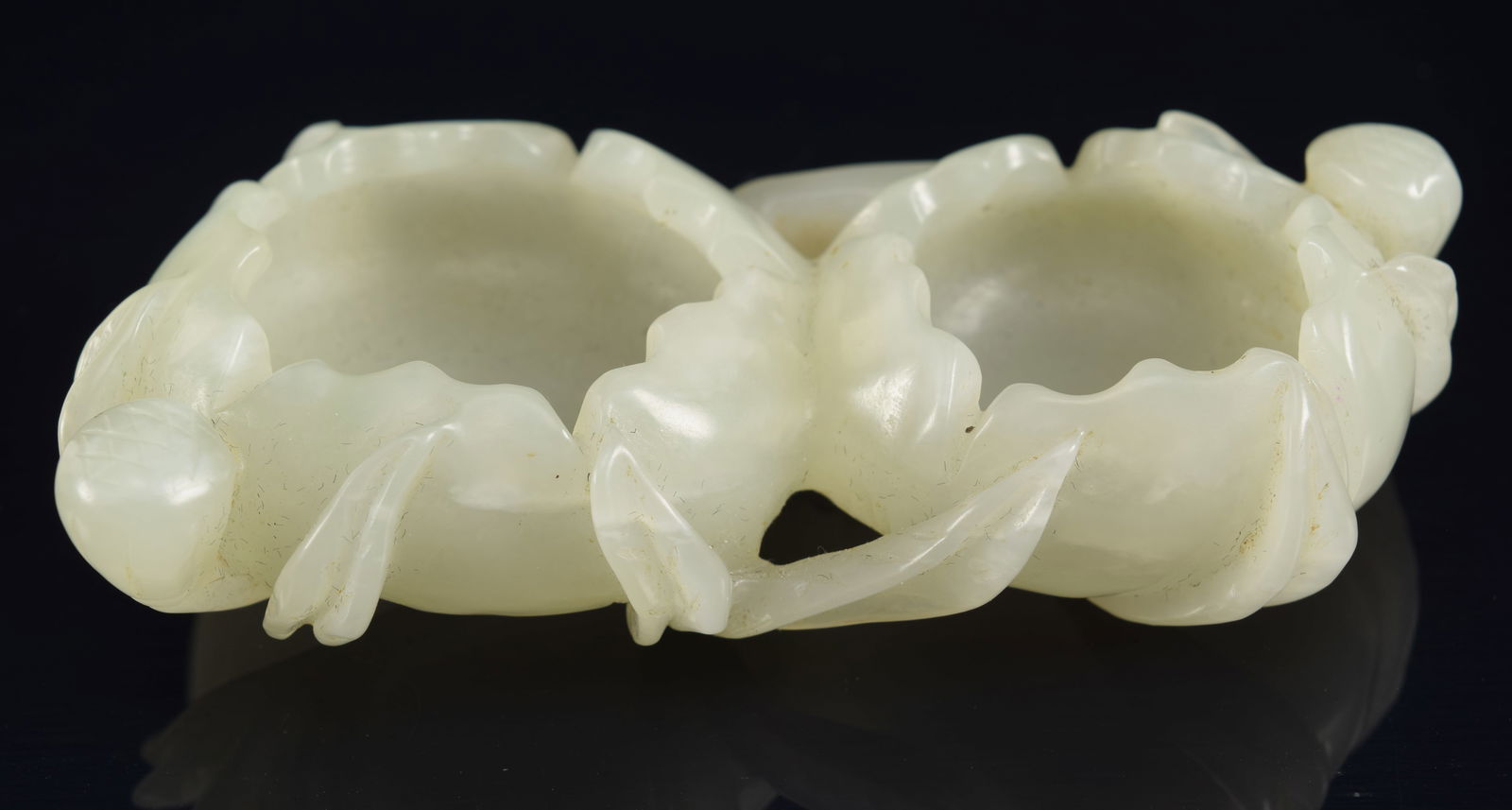 Water coupe. China. 19th century. Pale celadon stone. Carved as a pair of opening flowers with: Water coupe. China. 19th century. Pale celadon stone. Carved as a pair of opening flowers with foliage. 3.5in length.