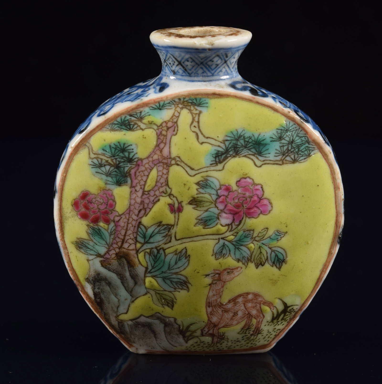 Porcelain snuff bottle. China. 19th century. Underglaze blue borders with scenes of cranes, deer and: Porcelain snuff bottle. China. 19th century. Underglaze blue borders with scenes of cranes, deer and flowering plants. 2.25in. Small chip on rim. Small flake chip on corner of foot rim.