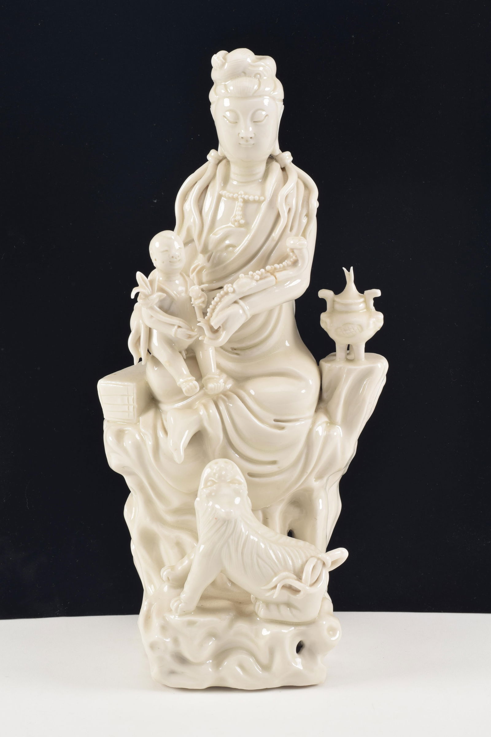 Porcelain figure of the goddess of mercy Kuan Yin with a tiger and a child. China. 20th century. Te (1 of 8)
