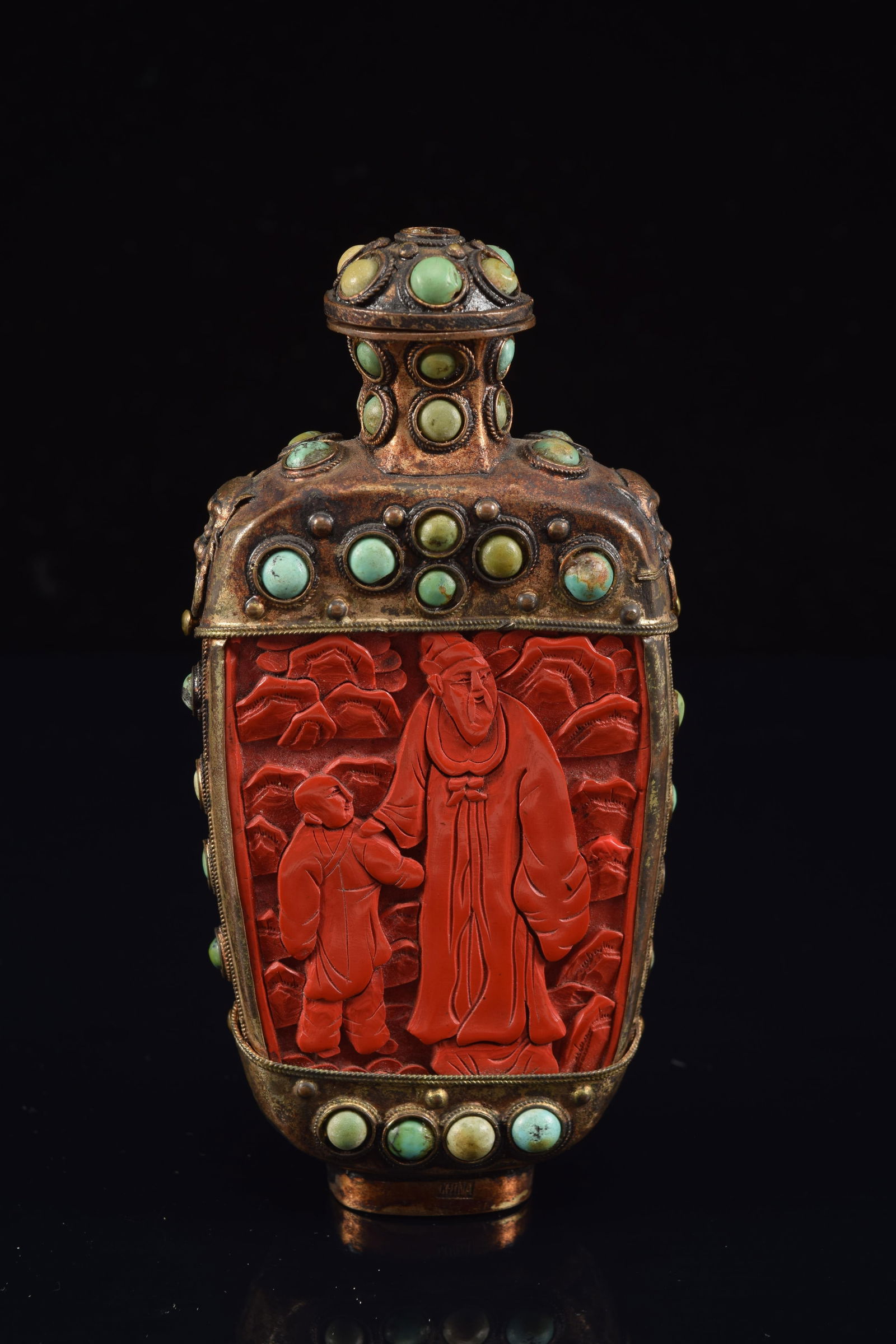 Snuff bottle. China. Ca. 1900. Carved cinnabar panels in a gilt set with turquoise cabochons. (1 of 5)