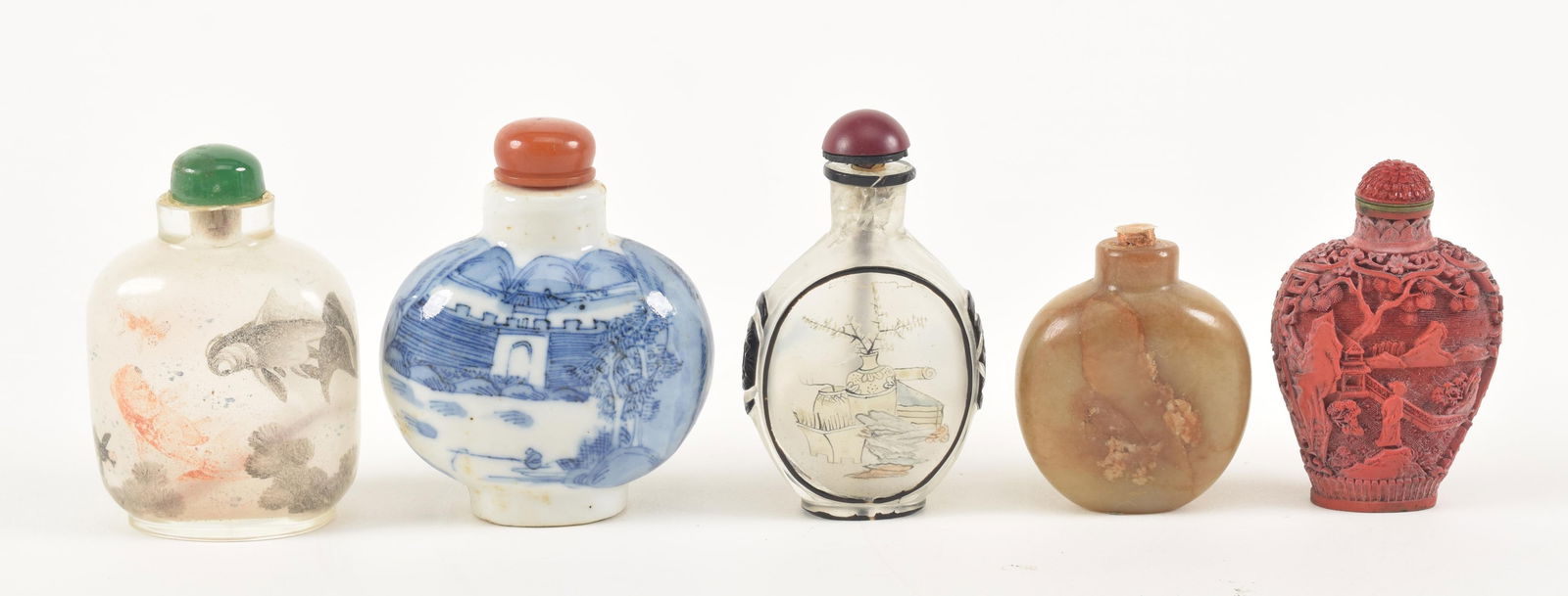 5 snuff bottles. China. 19th/early 20th century. 2 interior painted, one jade, one faux cinnabar, (1 of 6)