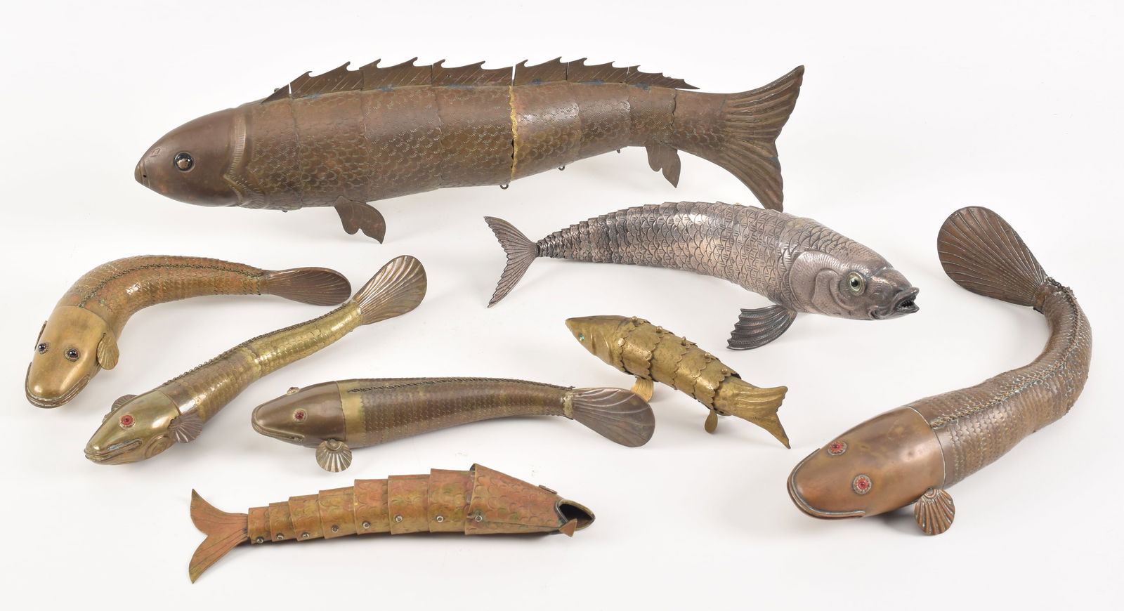 Lot of 8 articulated fish. Japan and India. 19th/20th century. 7 brass, 1 silver. Largest 15in (1 of 9)