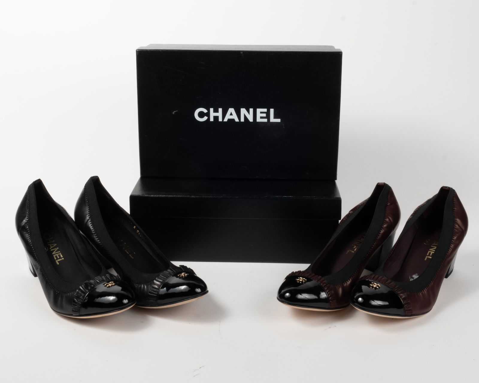 Two pairs Chanel Lambskin and patent leather elastic cap toe ballerina pumps. In original boxes with (1 of 13)