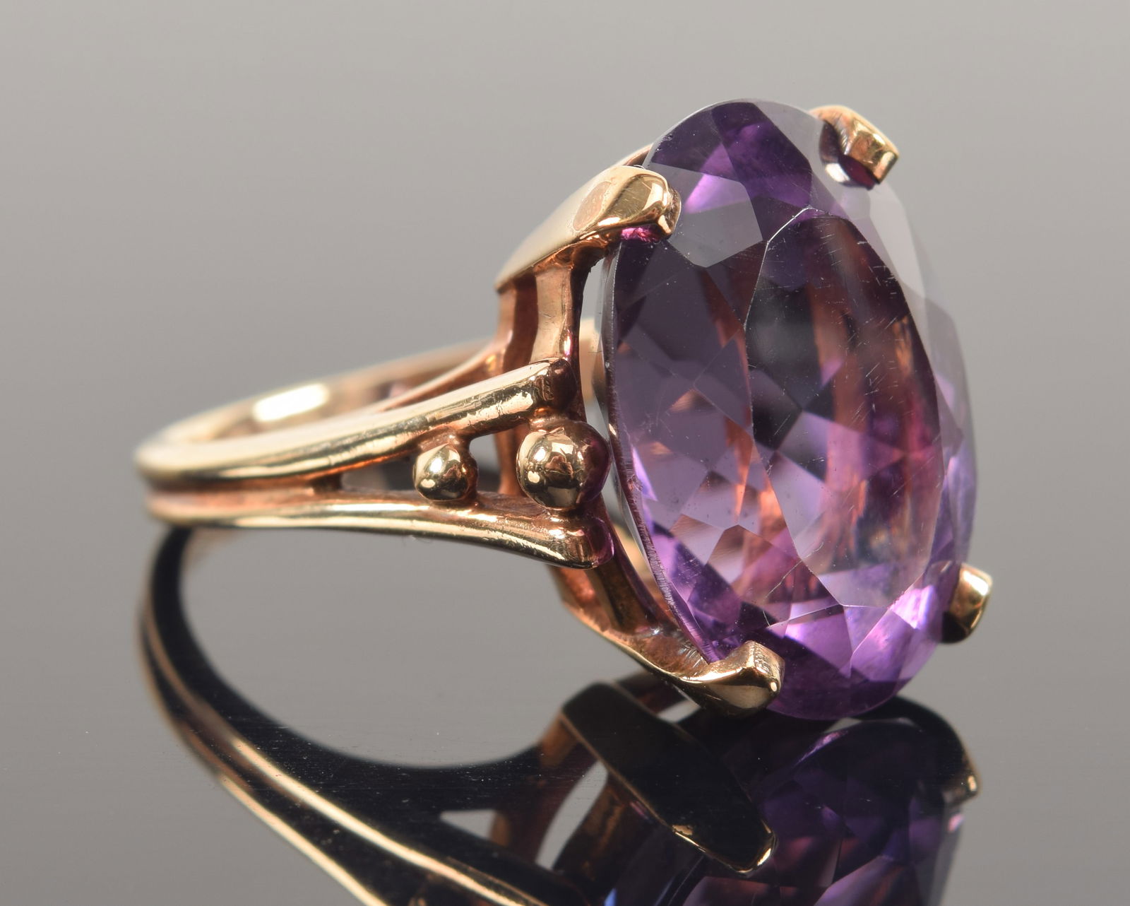 14K gold amethyst ring. Oval faceted amethyst measuring 18.2 x 13.3mm. Stamped 14K and KSK. Ring (1 of 6)