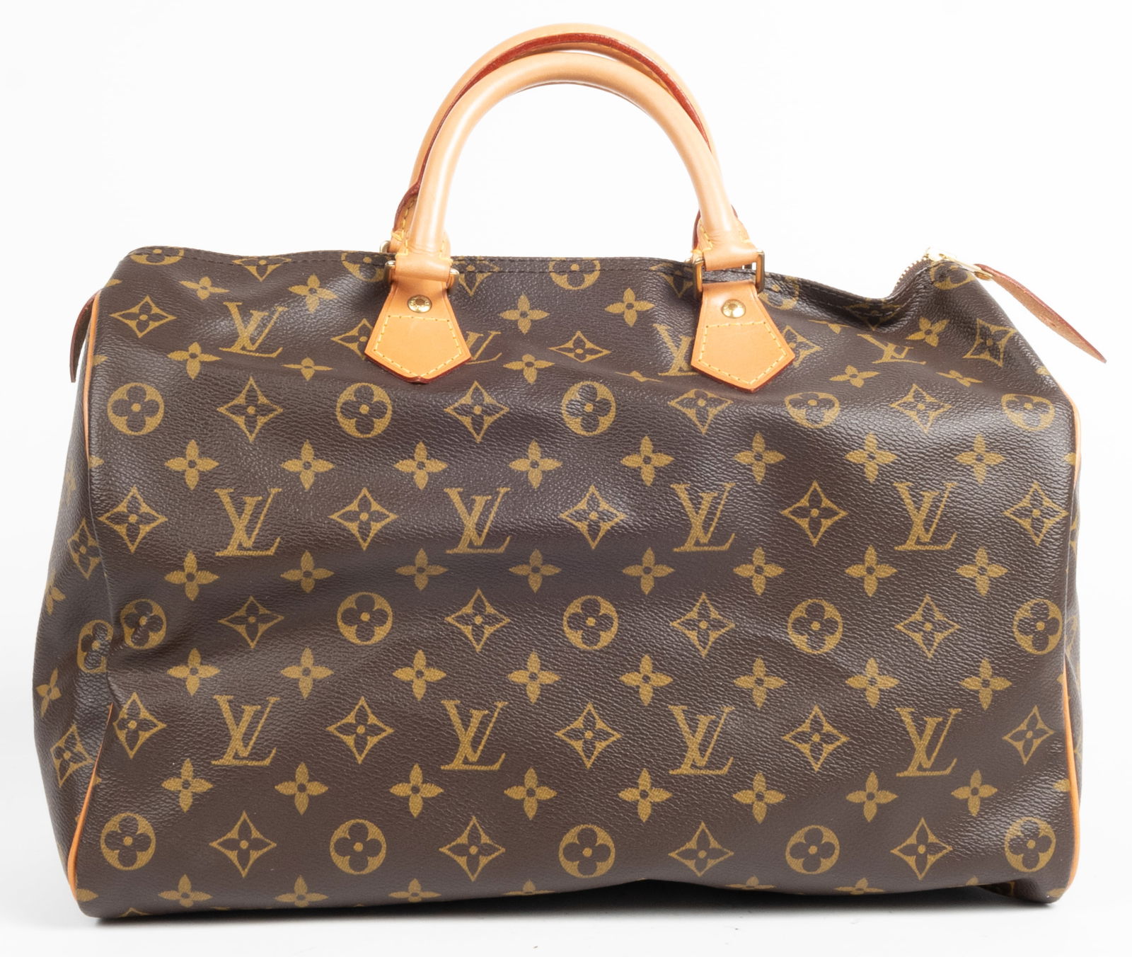 Louis Vuitton Speedy monogram bag in classic color. One interior pocket with flap. Canvas interior. (1 of 6)