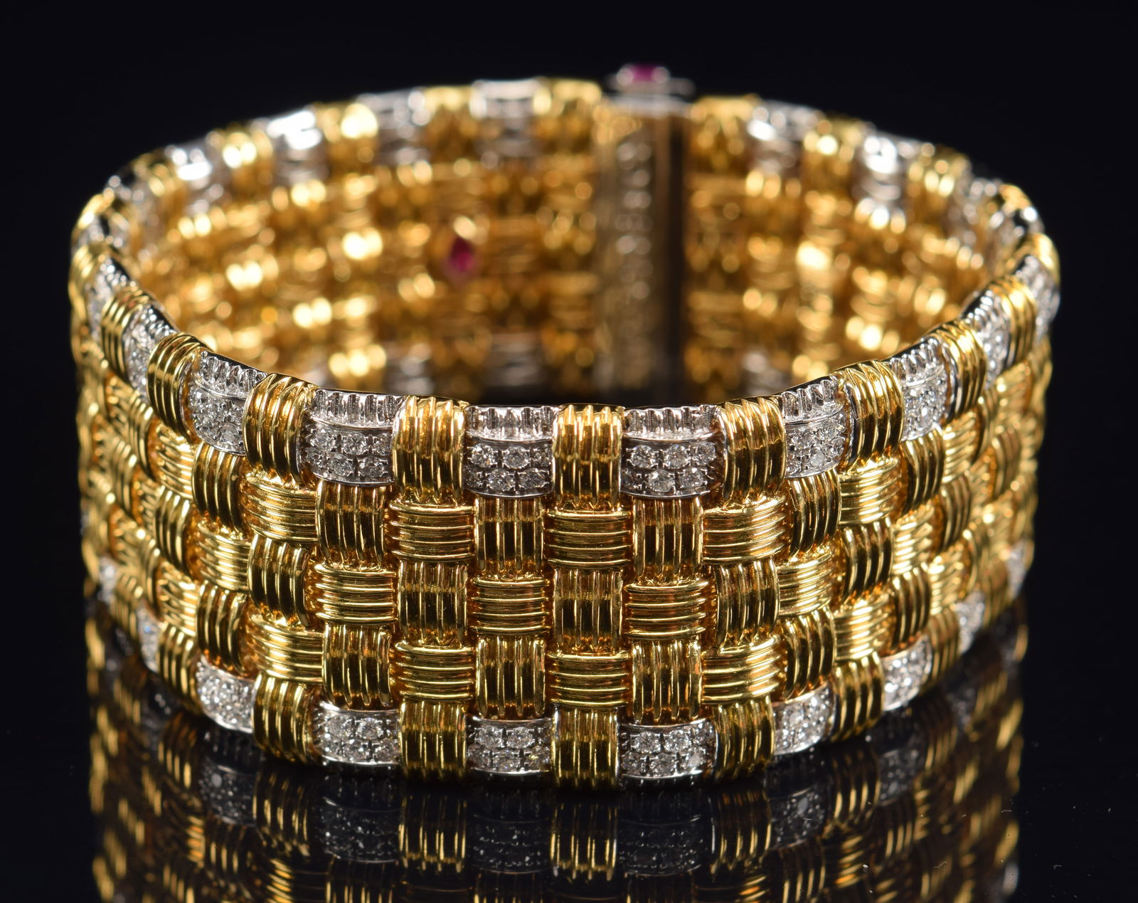 Roberto Coin 18K gold heavy diamond bracelet. White and yellow gold woven design with diamond: Roberto Coin 18K gold heavy diamond bracelet. White and yellow gold woven design with diamond encrusted caps and clasp. Ruby mounted clasp and hidden ruby on backside of bracelet in openwork design. M