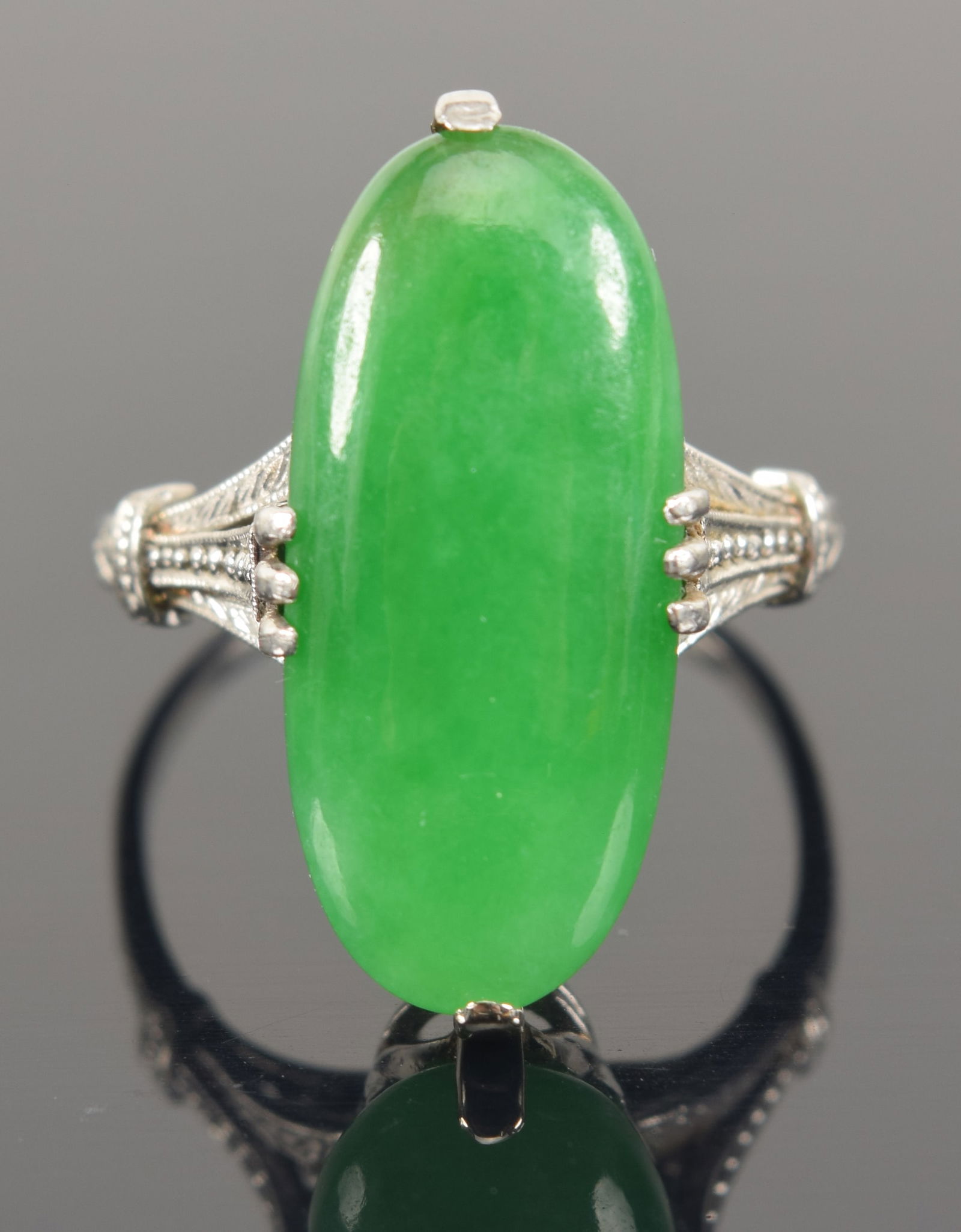 Vintage platinum jade ring. Elongated oval jade stone of a apple green color. Stone measures: 20 x (1 of 7)