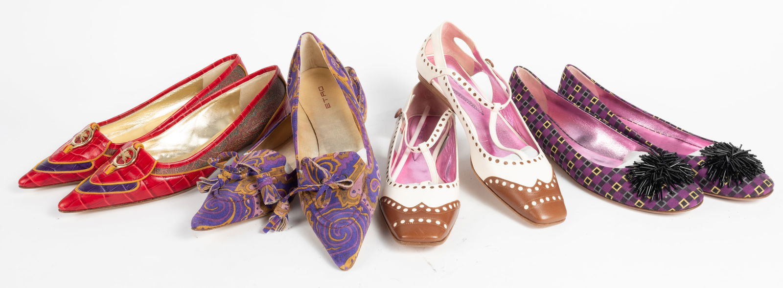 Four pairs of fabulous ETRO designer shoes. All size 38-1/2. (1) Multi colored crocodile leather: Four pairs of fabulous ETRO designer shoes. All size 38-1/2. (1) Multi colored crocodile leather with gold metal ETRO logo embellishment and very low heel. (2) Purple paisley print suede with ties, ve