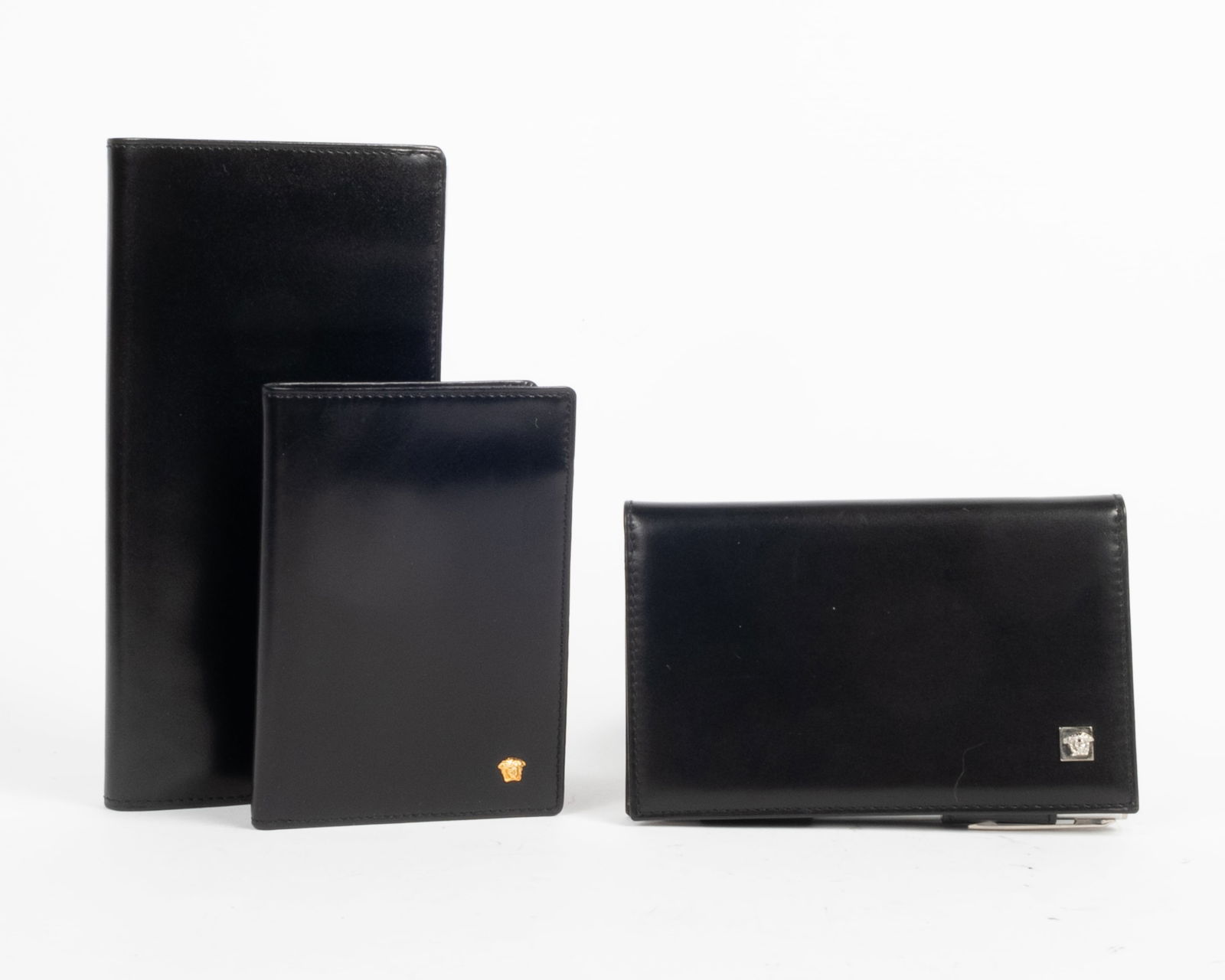 Lot of three Gianni Versace black leather items. (1) Black with gold Versace emblem. Hot pink (1 of 7)