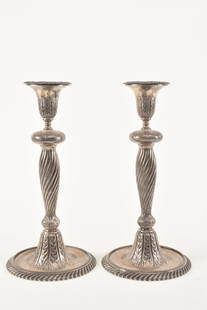 Pair of Gorham fine quality sterling silver candlesticks, late 19th century. Gadrooned bases with: Pair of Gorham fine quality sterling silver candlesticks, late 19th century. Gadrooned bases with embossed and etched foliate decoration. Marked on base. Monogrammed on base. 12in high.