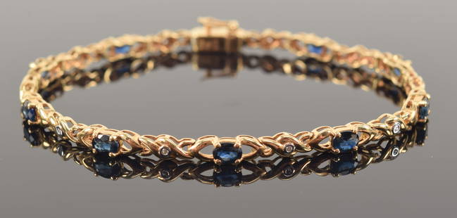 14K gold diamond and sapphire mounted bracelet with oval sapphire stones. 6.75in length without clas: 14K gold diamond and sapphire mounted bracelet with oval sapphire stones. 6.75in length without clasp. Marked 14K. 6.5 grams.