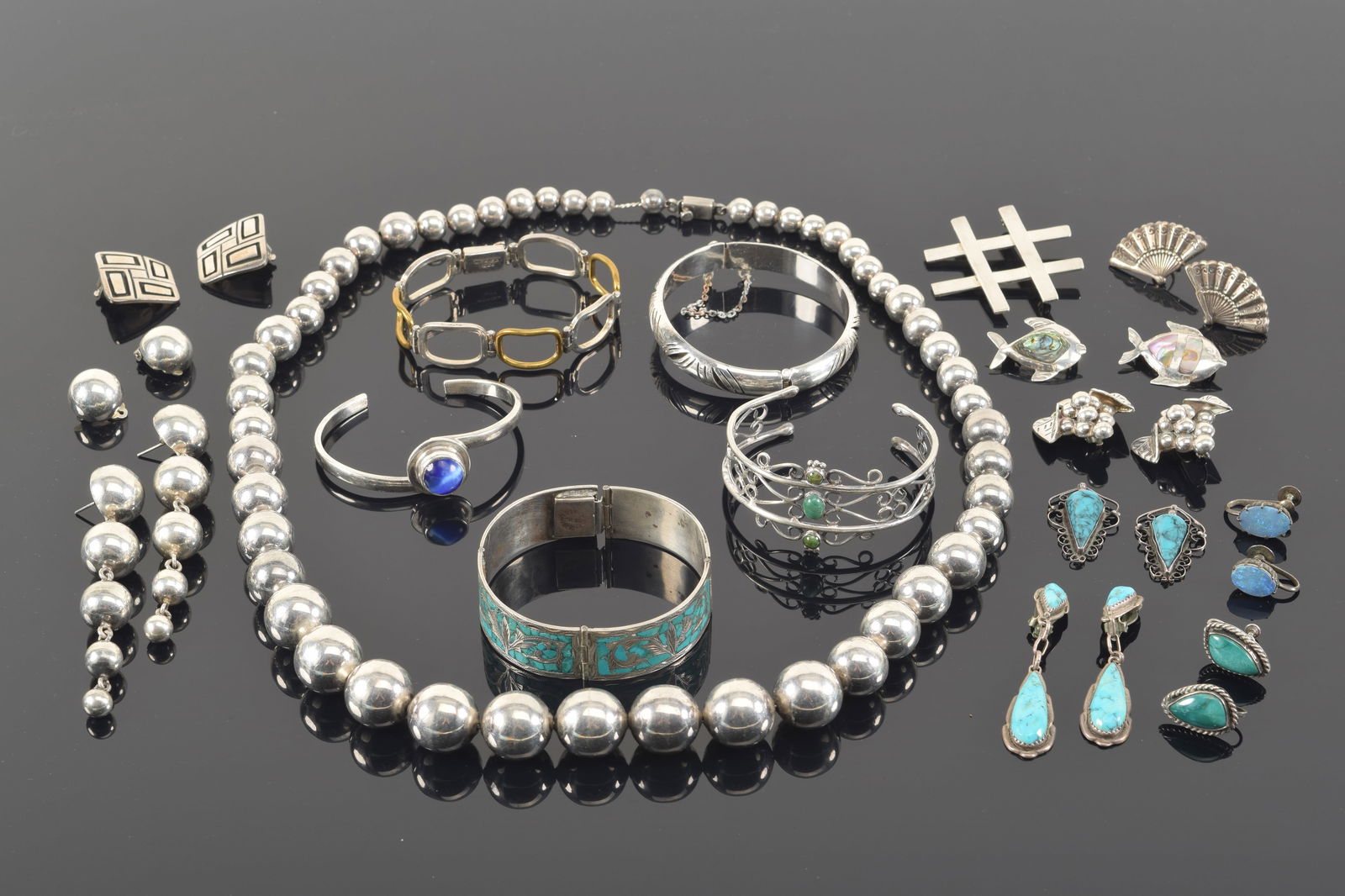 Lot of southwestern style Mexican sterling silver jewelry. To include: 1) Graduated hollow bead (1 of 7)