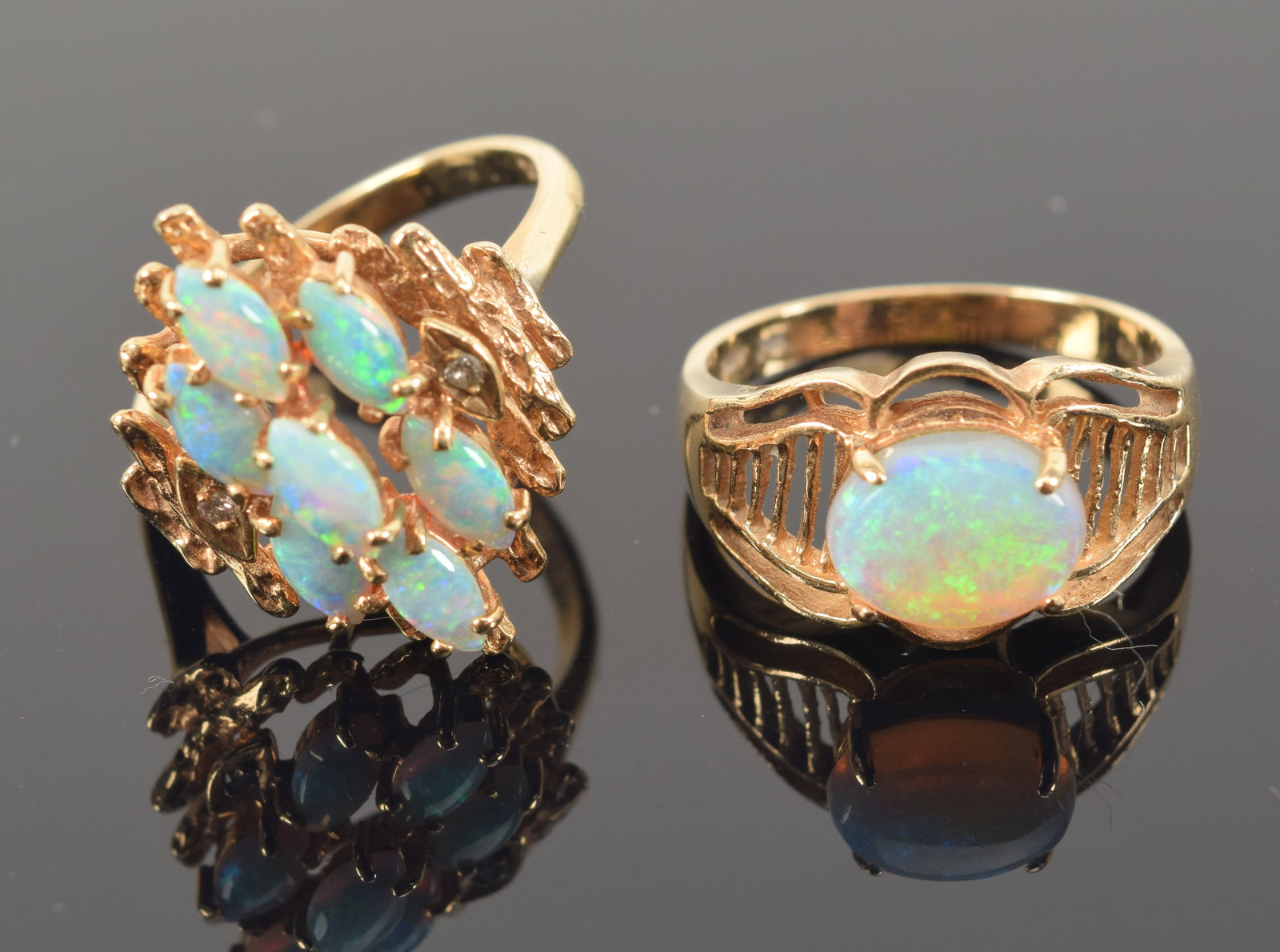 2 gold opal rings. 1) Tiered cluster form 10K gold ring with tiny diamonds. Marked 10ct. Ring size (1 of 6)