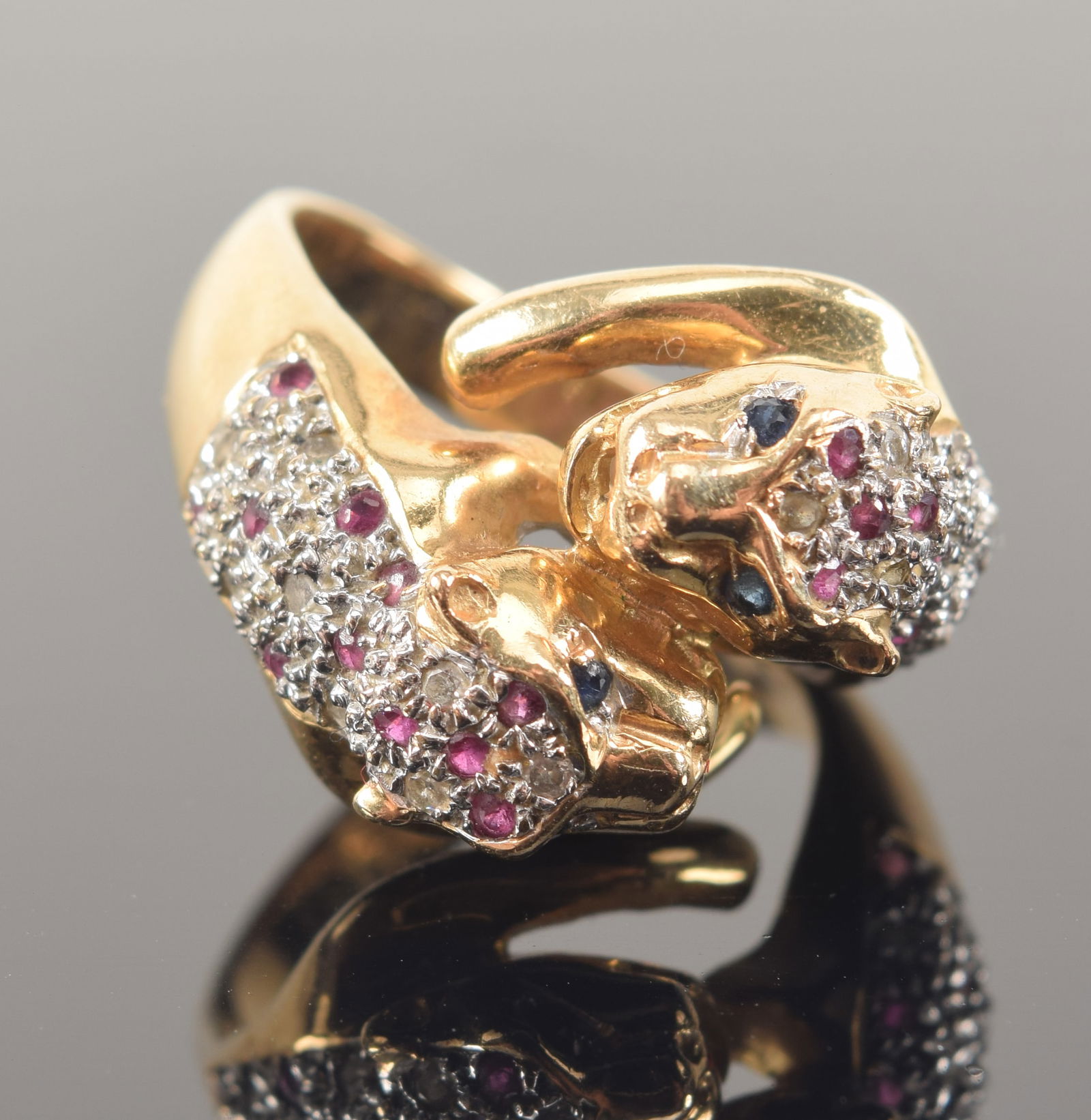 14K gold jaguar form diamond, ruby, and sapphire mounted ring. Marked 14K 585. Ring size 7. Slight (1 of 7)