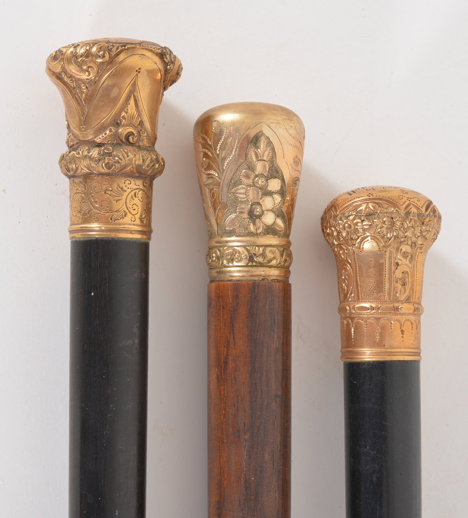 3 Victorian gold knob topped walking sticks, two with ebony shafts, one lignum vitae. Date 1862, (1 of 6)