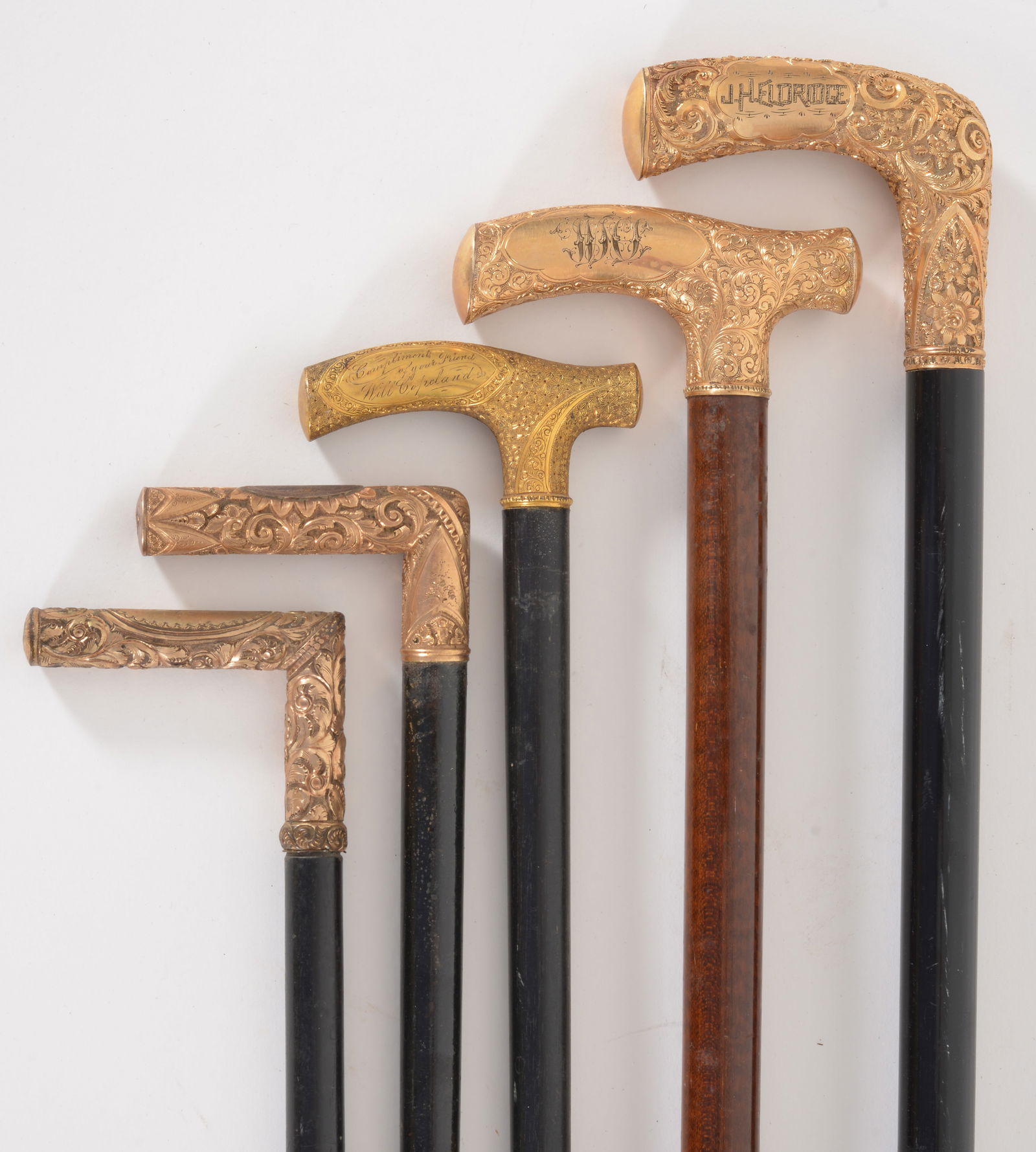 5 Victorian gold topped walking sticks, two with "T" shaped tops and three with "L" shaped tops. (1 of 8)