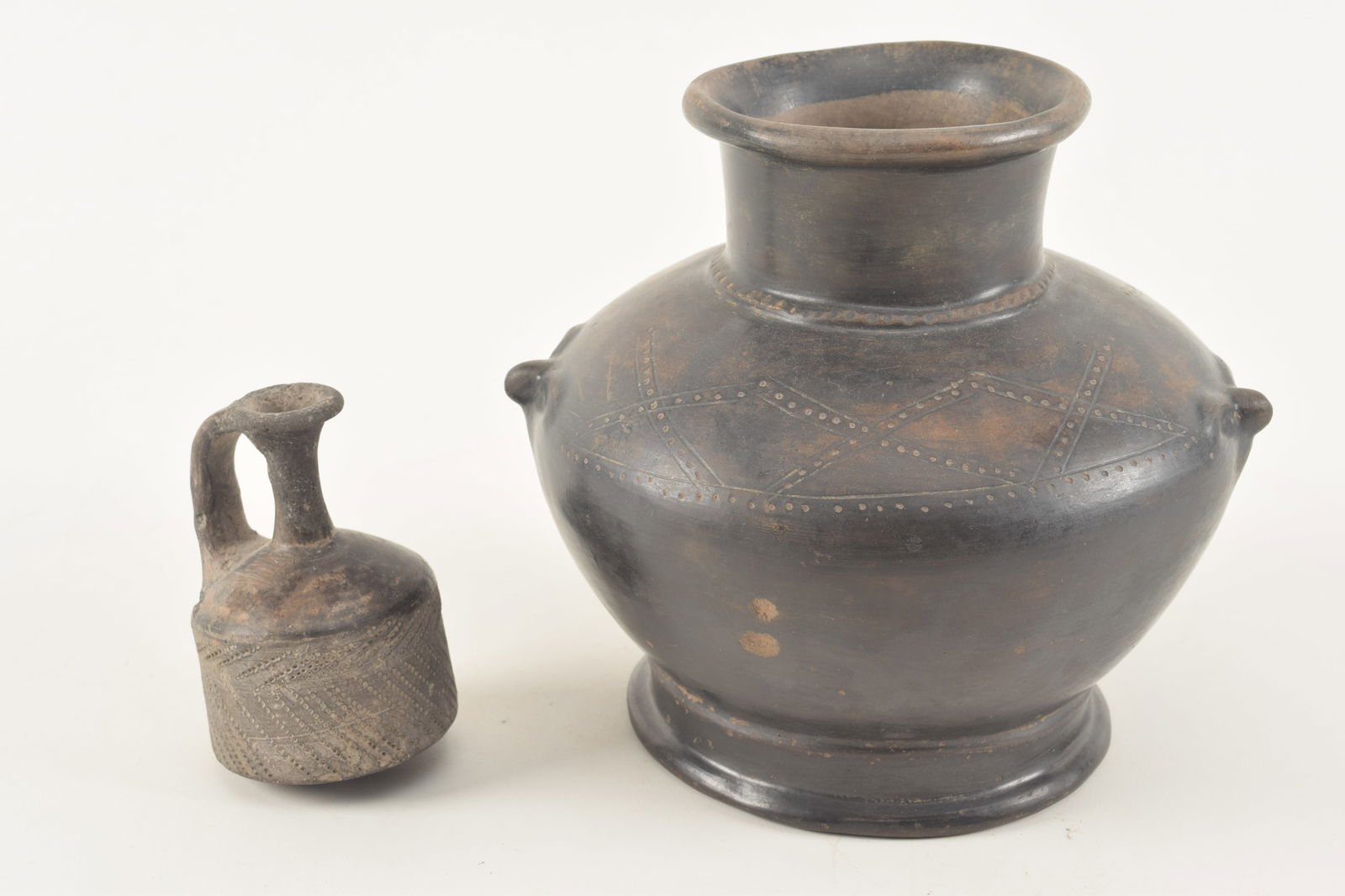 2 Pre-Columbian pottery vessels. 1) Small handled jug with inscribed pinpoint decoration. 2) Large (1 of 9)