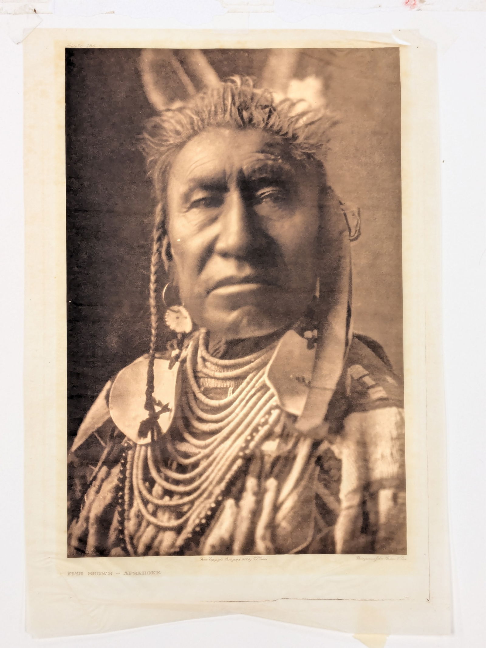 Edward Curtis. "Fish Shows - Apsaroke". Photogravure on Japanese tissue paper. Plate 185. Tear upper (1 of 10)