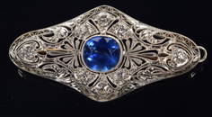 Edwardian Burmese natural untreated sapphire mounted platinum and diamond brooch. Central oval