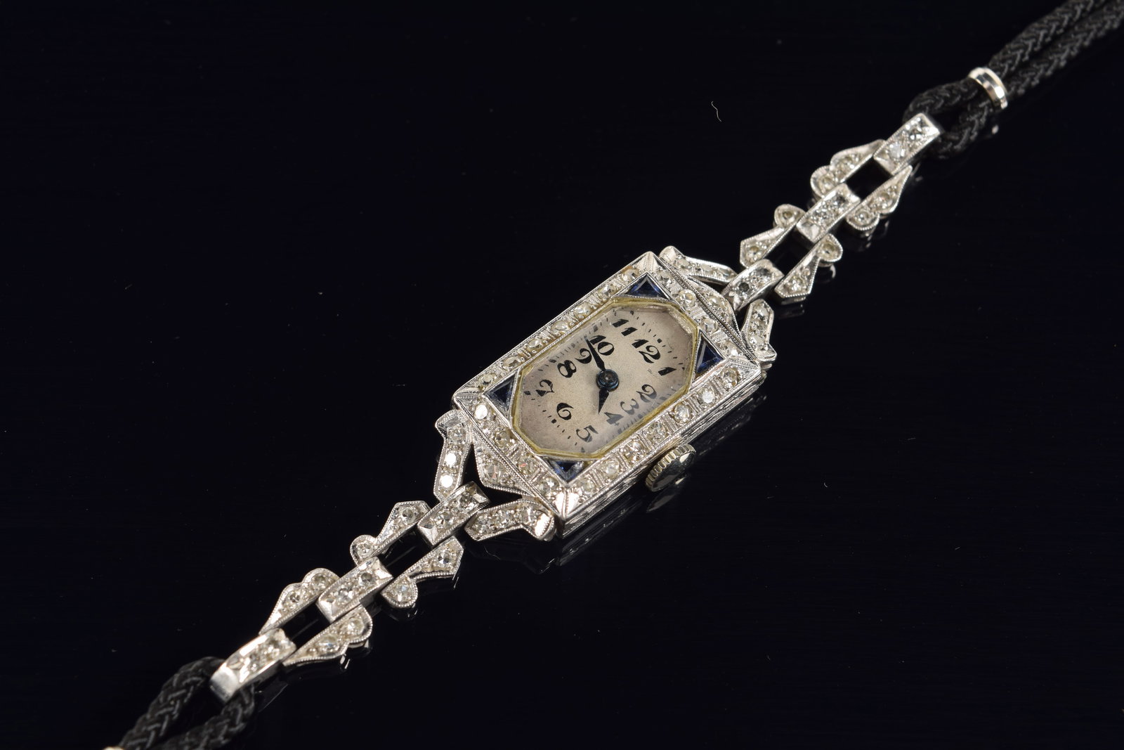 Vintage Hamilton platinum diamond and sapphire mounted ladies wristwatch. Marked platinum inside of: Vintage Hamilton platinum diamond and sapphire mounted ladies wristwatch. Marked platinum inside of case. Clasp marked 10K. 17.2 grams total weight.
