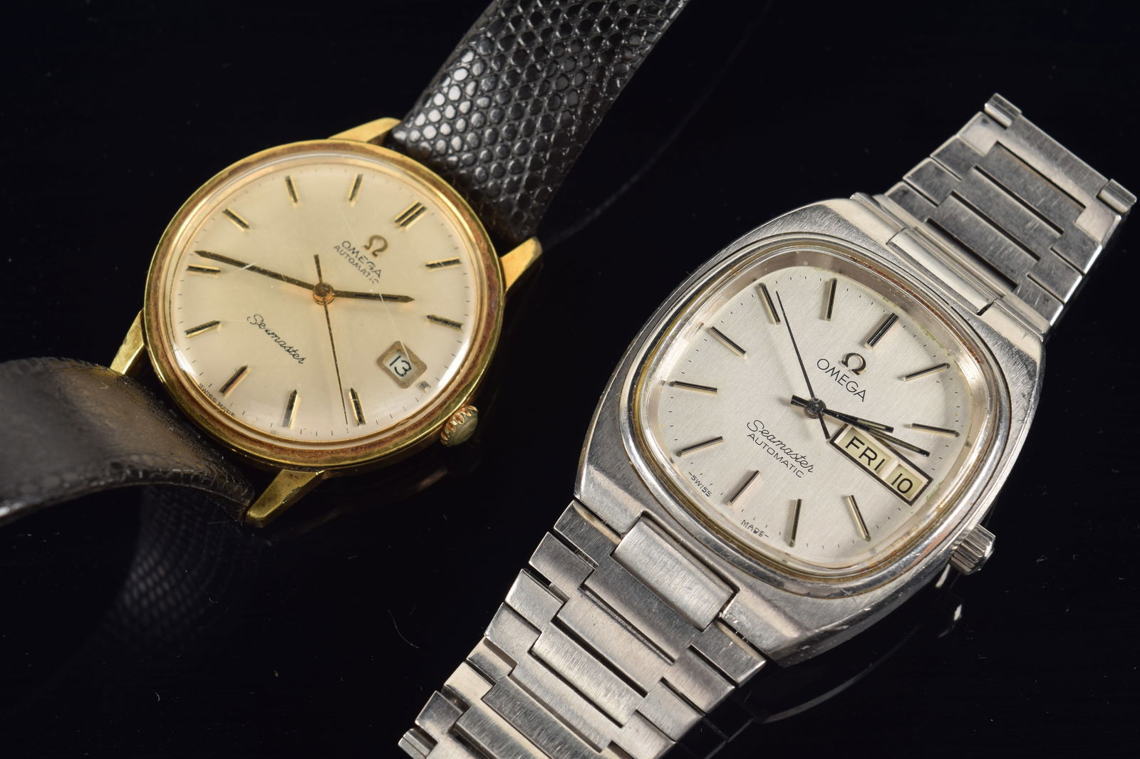 2 Omega Seamaster wristwatches. 1) Gold tone watch with scratched crystal. Leather band. 2) (1 of 3)
