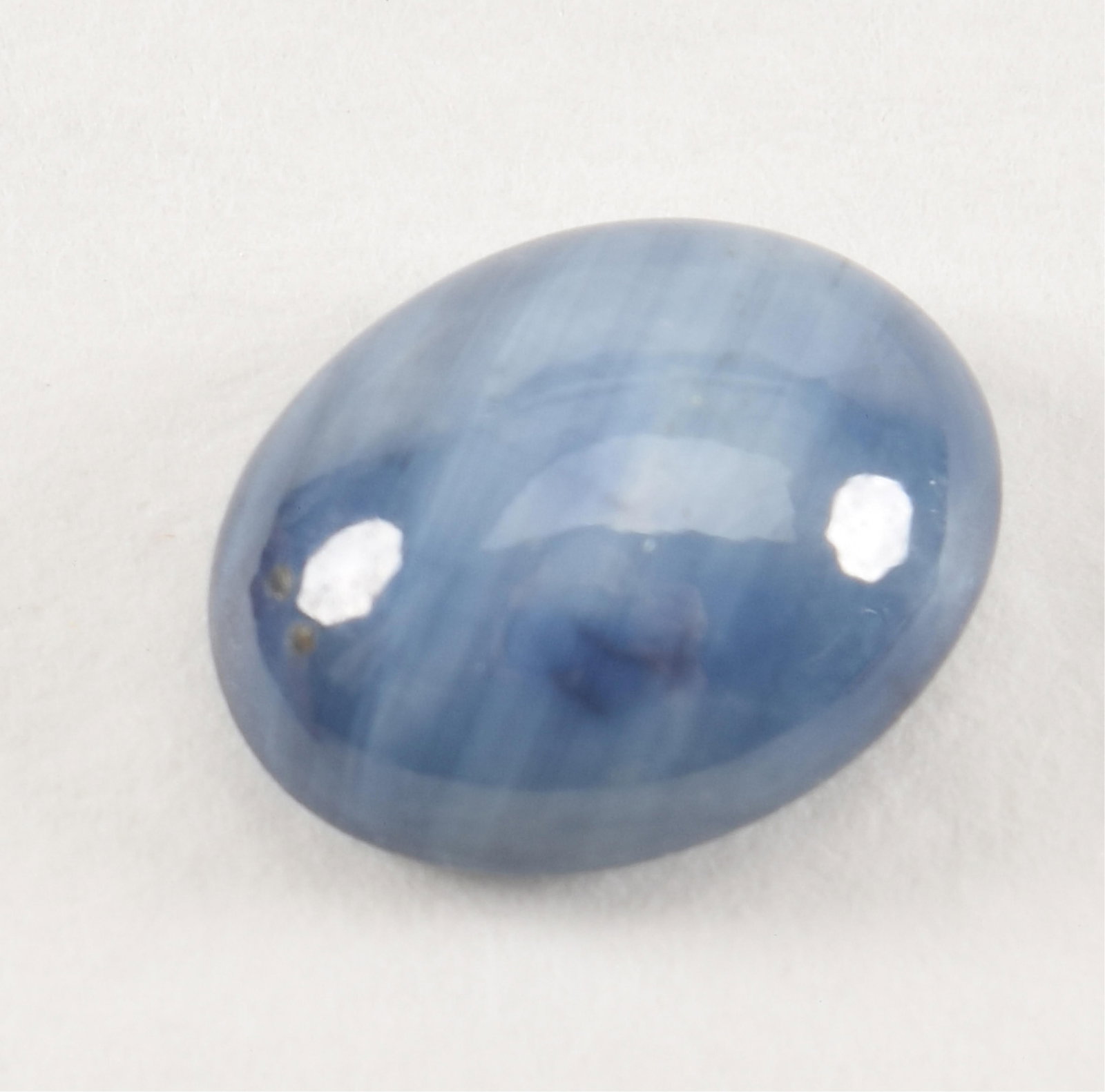 [2] unmounted star sapphire gemstones. Each an oval cabochon with 1 weighing 3.06CT and the other (1 of 4)