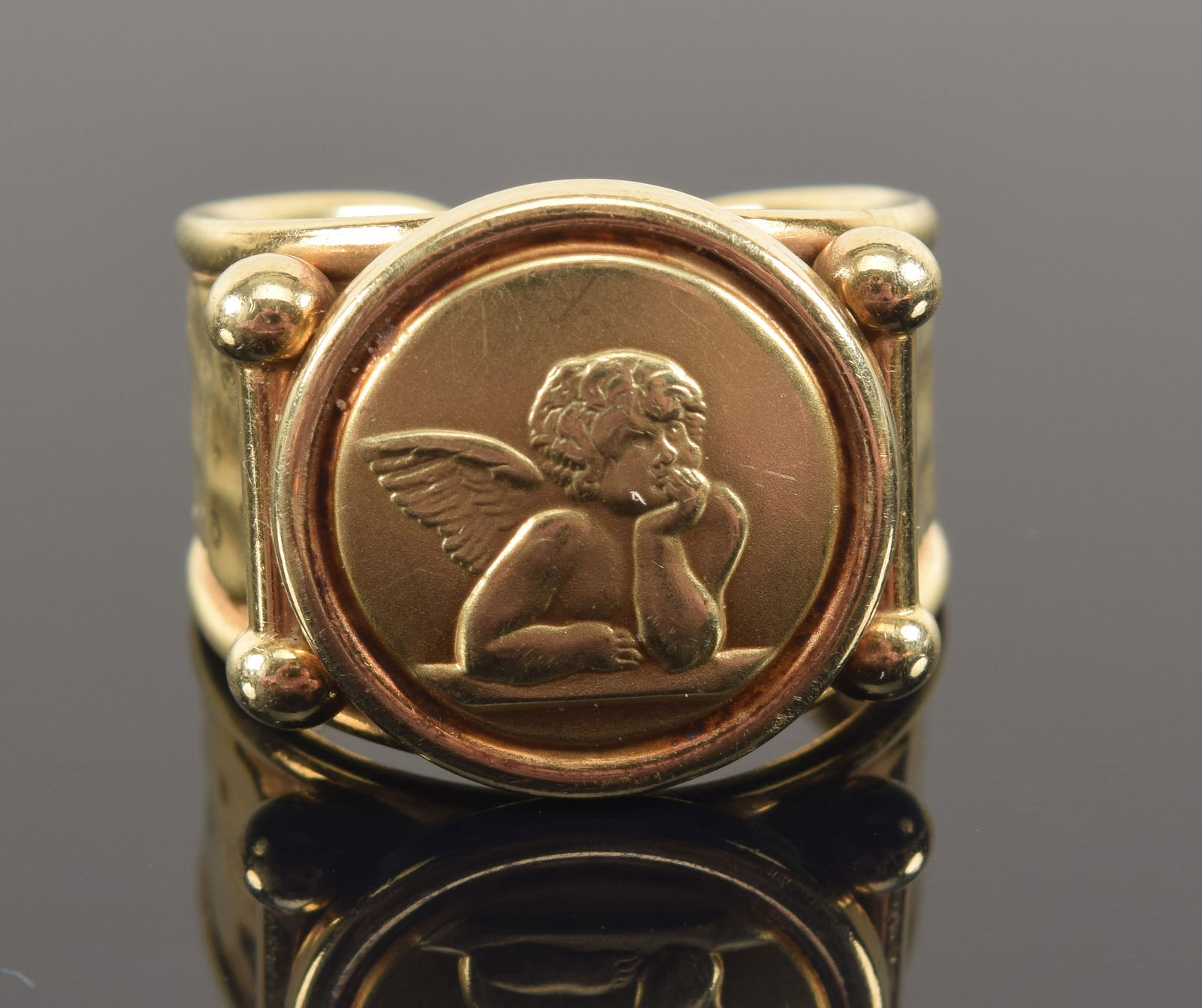 14K gold Renaissance style ring set with a medallion depicting one of Raphael's angels. Marked 14K: 14K gold Renaissance style ring set with a medallion depicting one of Raphael's angels. Marked 14K Italy. Ring size 8/8.25. 6 grams.