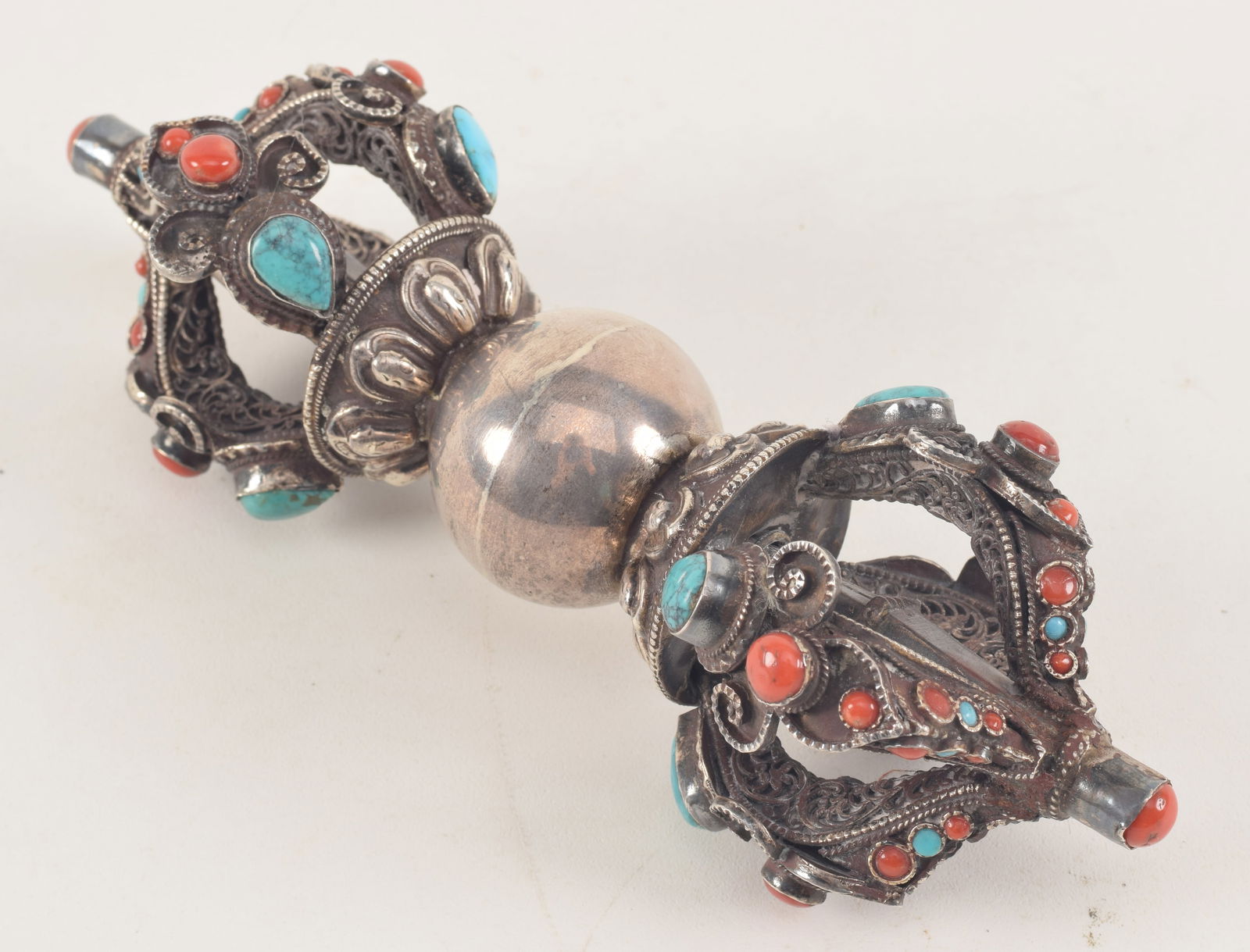 19th/20th century Tibetan silver vajra with elaborate design of coral and turquoise mounted stones. (1 of 4)