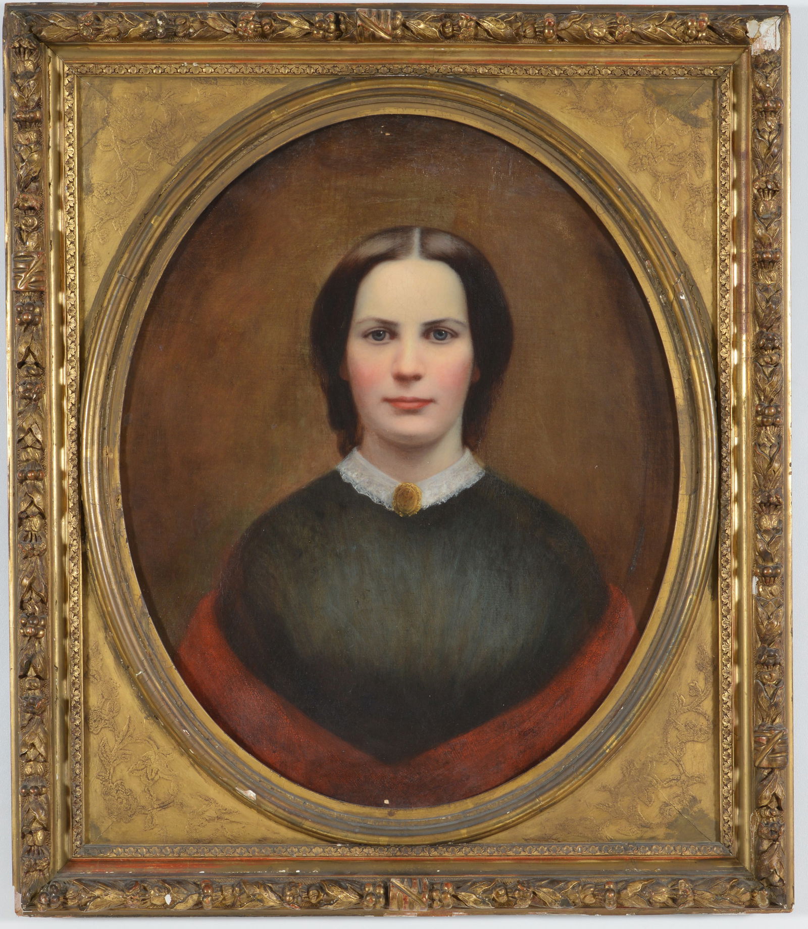 American school, mid 19th Century. Oval format portrait of a woman with a lace collar and gold: American school, mid 19th Century. Oval format portrait of a woman with a lace collar and gold brooch. Framed. Cleaned. Image 27 x 22 in. Overall size 34.5 x 28.5 in.