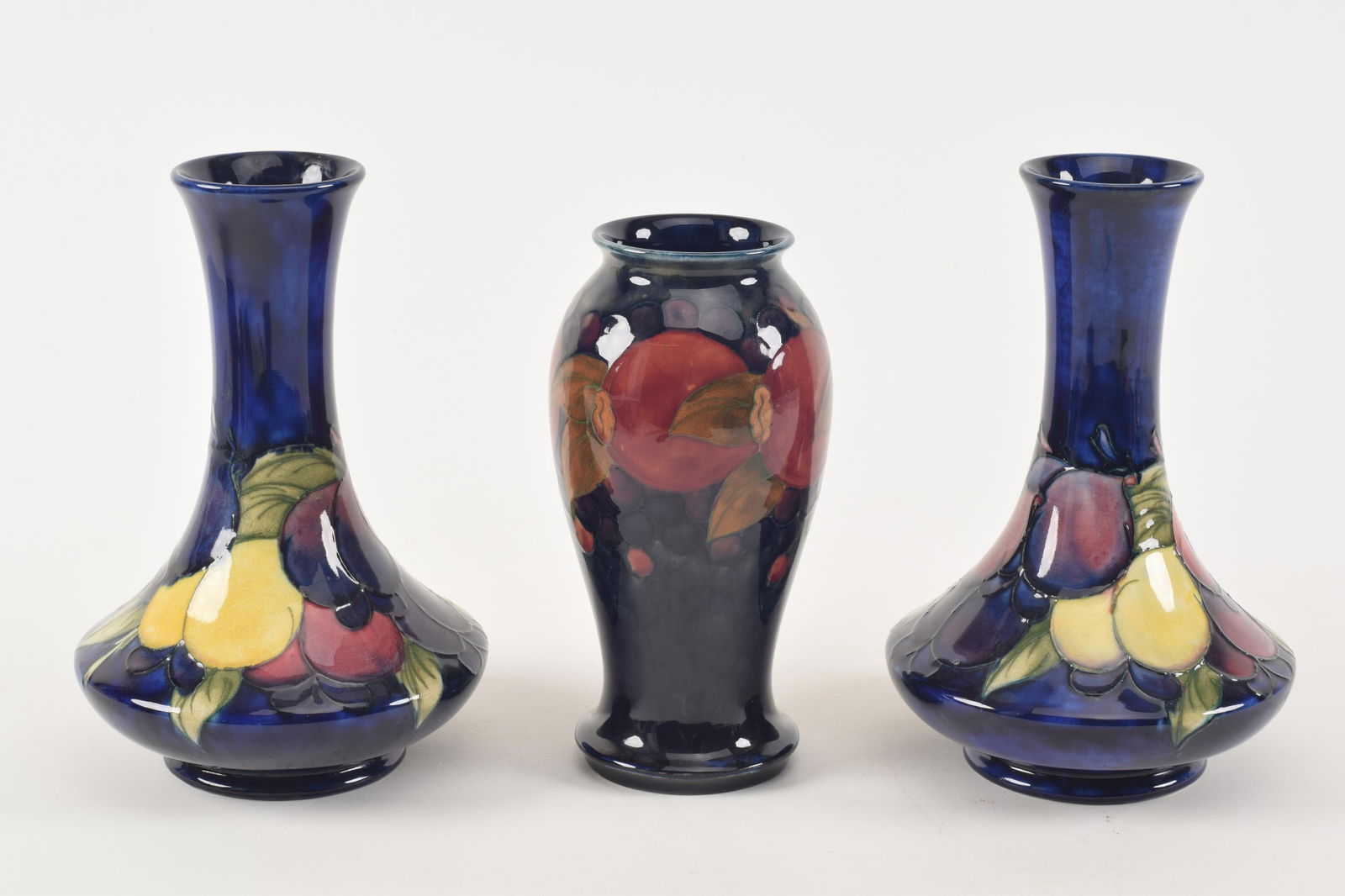 3 Pieces of Moorcroft pottery, to include a pair of compressed baluster vases with grape and leaf (1 of 8)