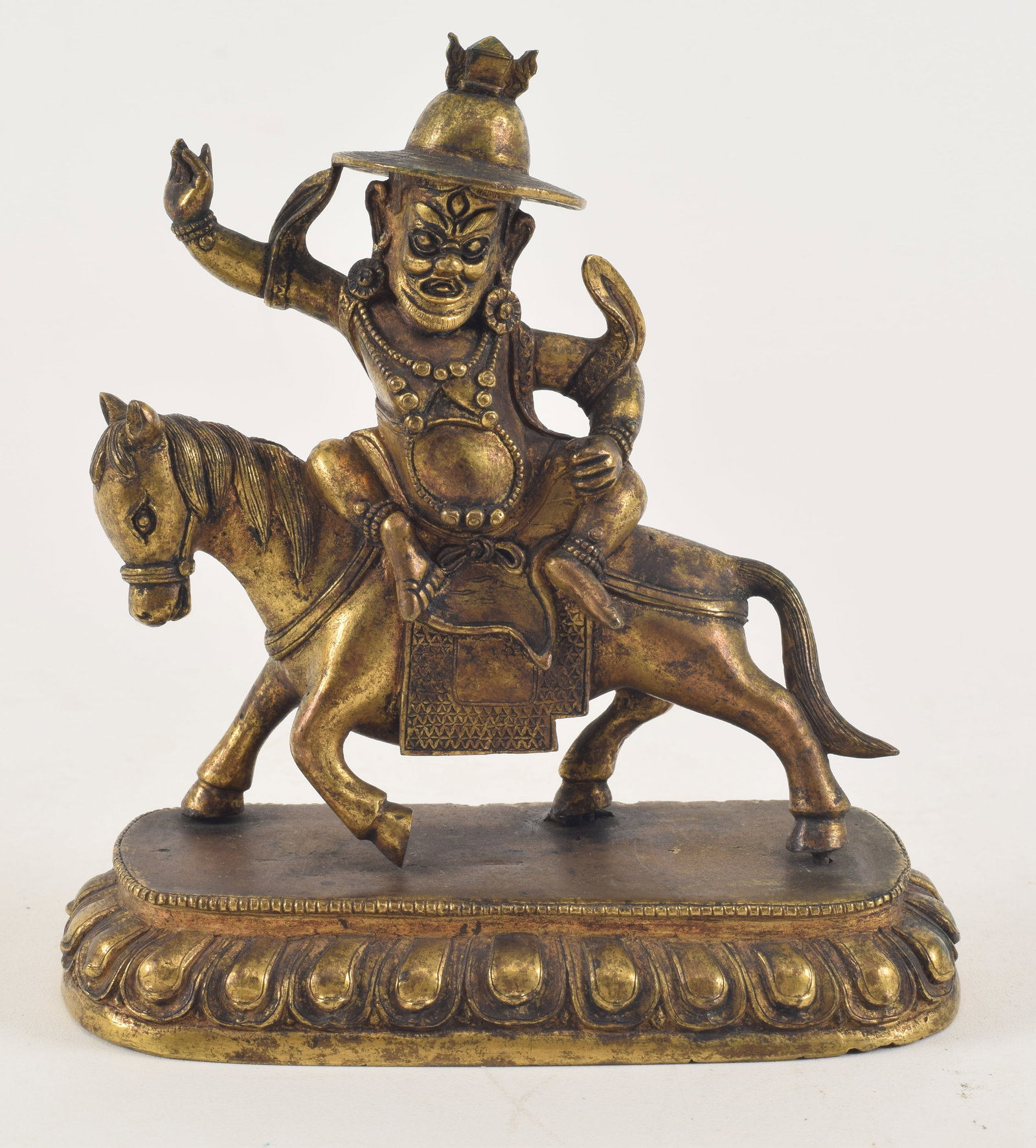 Gilt bronze image. Tibet. 18th century. Figure of Phalden Lhama on a horse. 5.25in high. (1 of 5)
