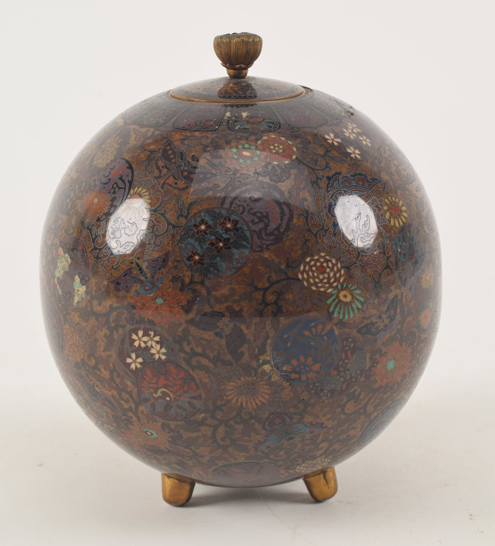 Cloisonne covered jar. Japan. Meiji period (1868-1912). Globular form. Possibly the work of Namikawa: Cloisonne covered jar. Japan. Meiji period (1868-1912). Globular form. Possibly the work of Namikawa Yasuyuki. 6in high. Loss.