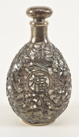 Silver repousse mounted pinch bottle. Chinese export. Early 20th century.
