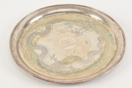 Chinese export silver tray. Early 20th century. Decoration of dragons on a textured ground.