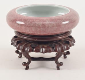 Porcelain brush washer. China. Ca. 1900. Peach bloom glaze. Fitted stand. 4.75in diameter.