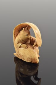 Netsuke. Japan. 19th century. Gyokuzan. Cat pacifying Namazu (earthquake fish). A parody of the tale