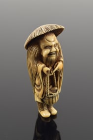 Netsuke. Japan. 18th century. Kyoto school. Moso. A Paragon of Fillal Piety with his basket of bambo